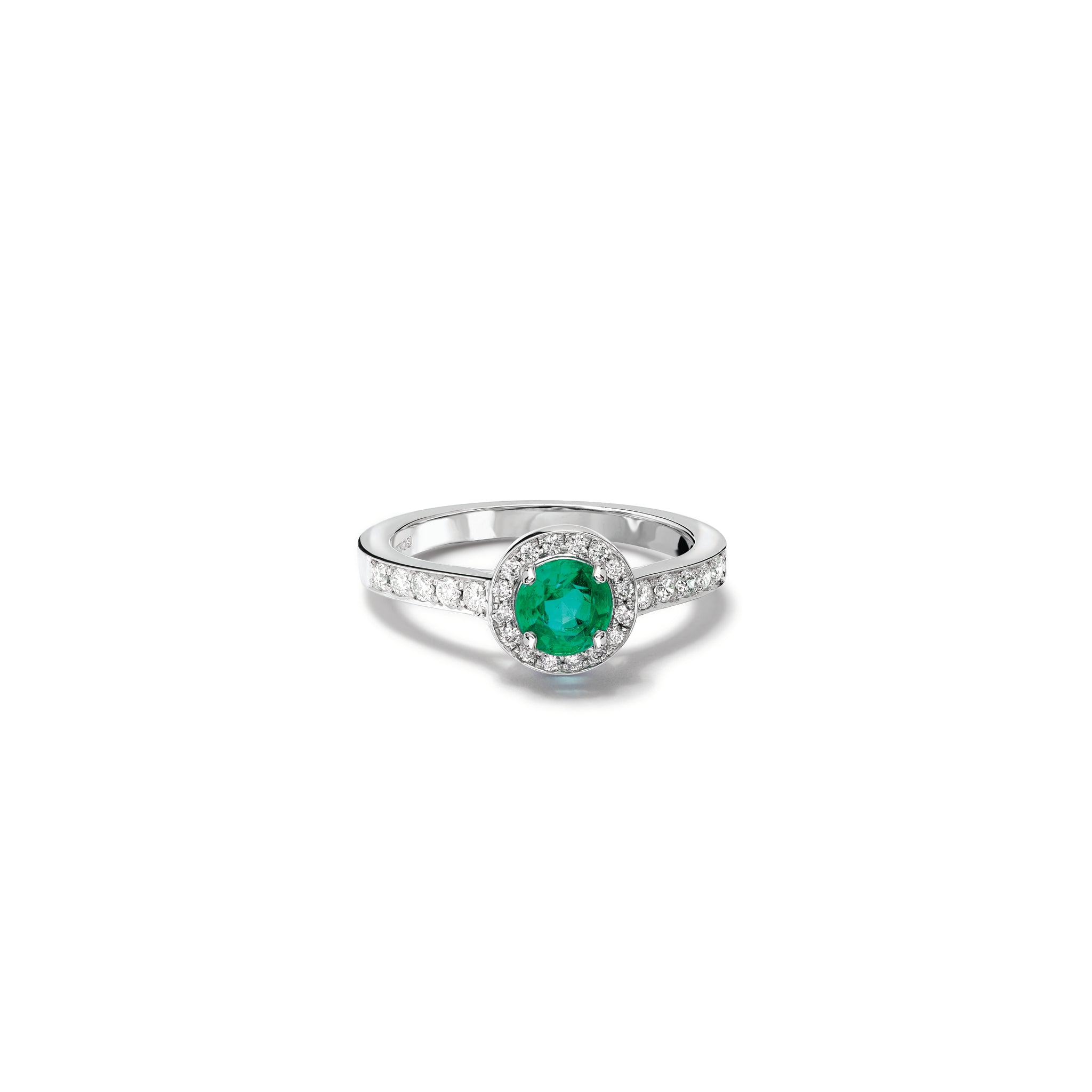 Handcrafted 18ct white gold engagement ring with a round emerald at the centre, surrounded by smaller diamonds. The band of the engagement ring is also set with small diamonds.