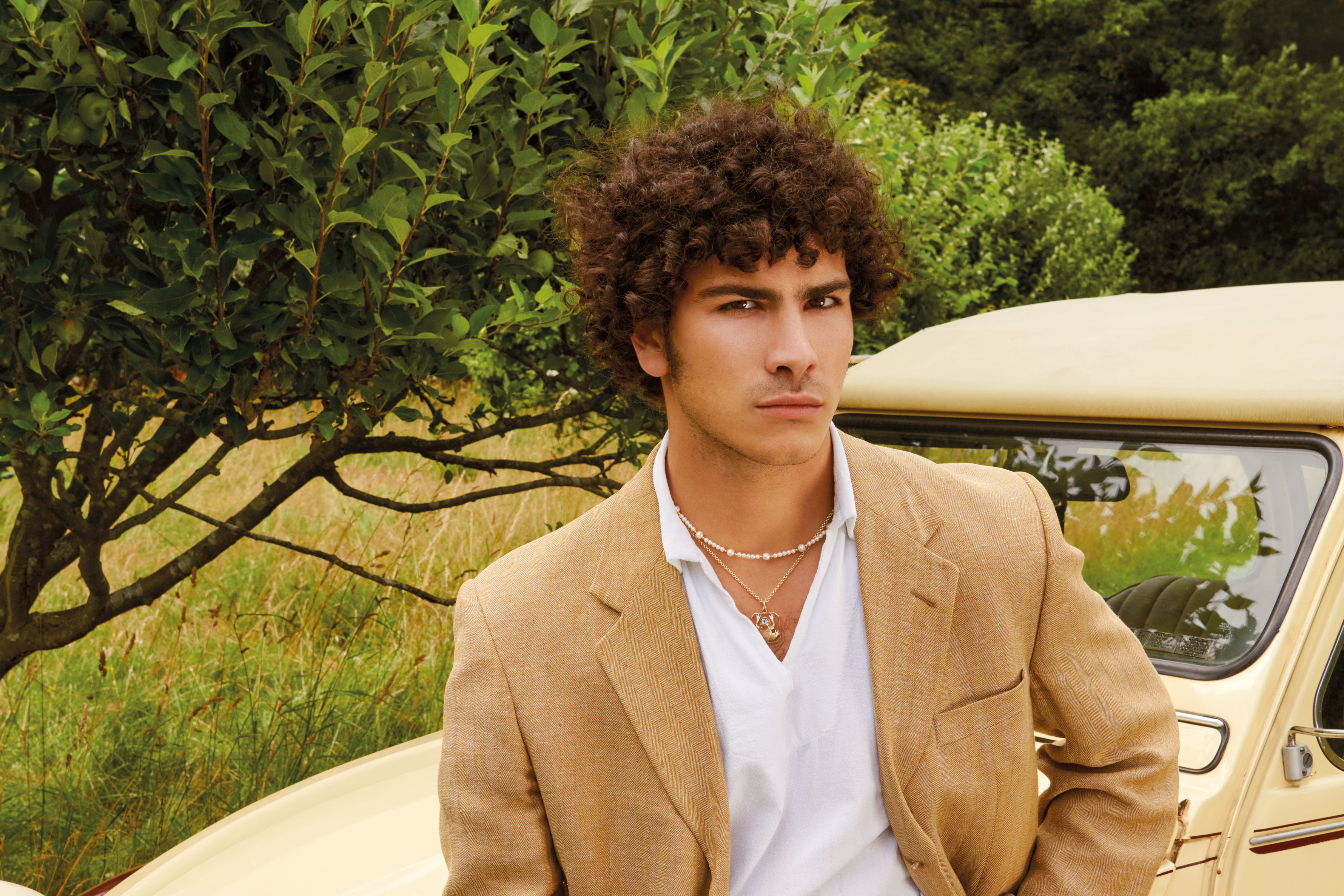 Model wearing handcrafted pearl jewellery for men.