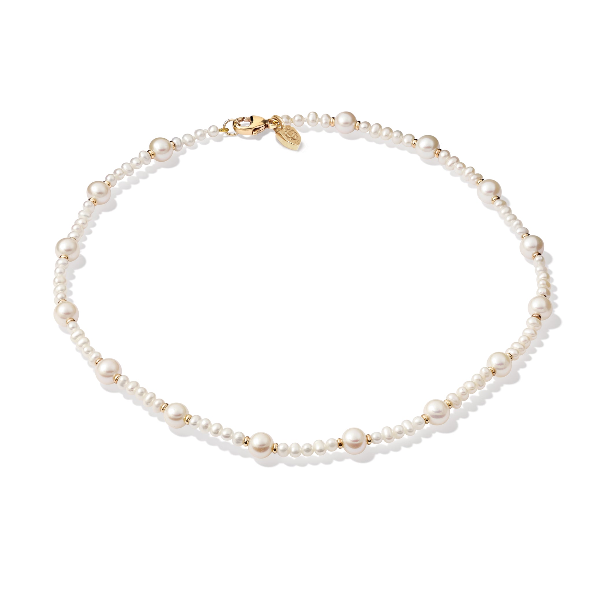 Handcrafted yellow gold necklace with small pearls.