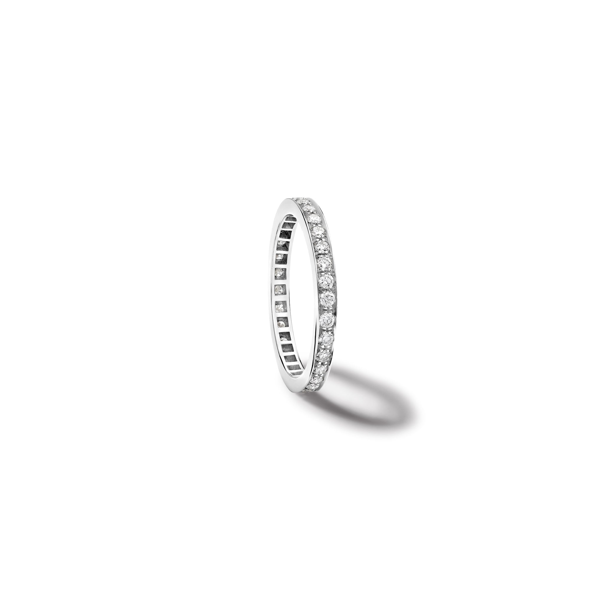Handcrafted 18ct white gold wedding band with diamonds set along the band.