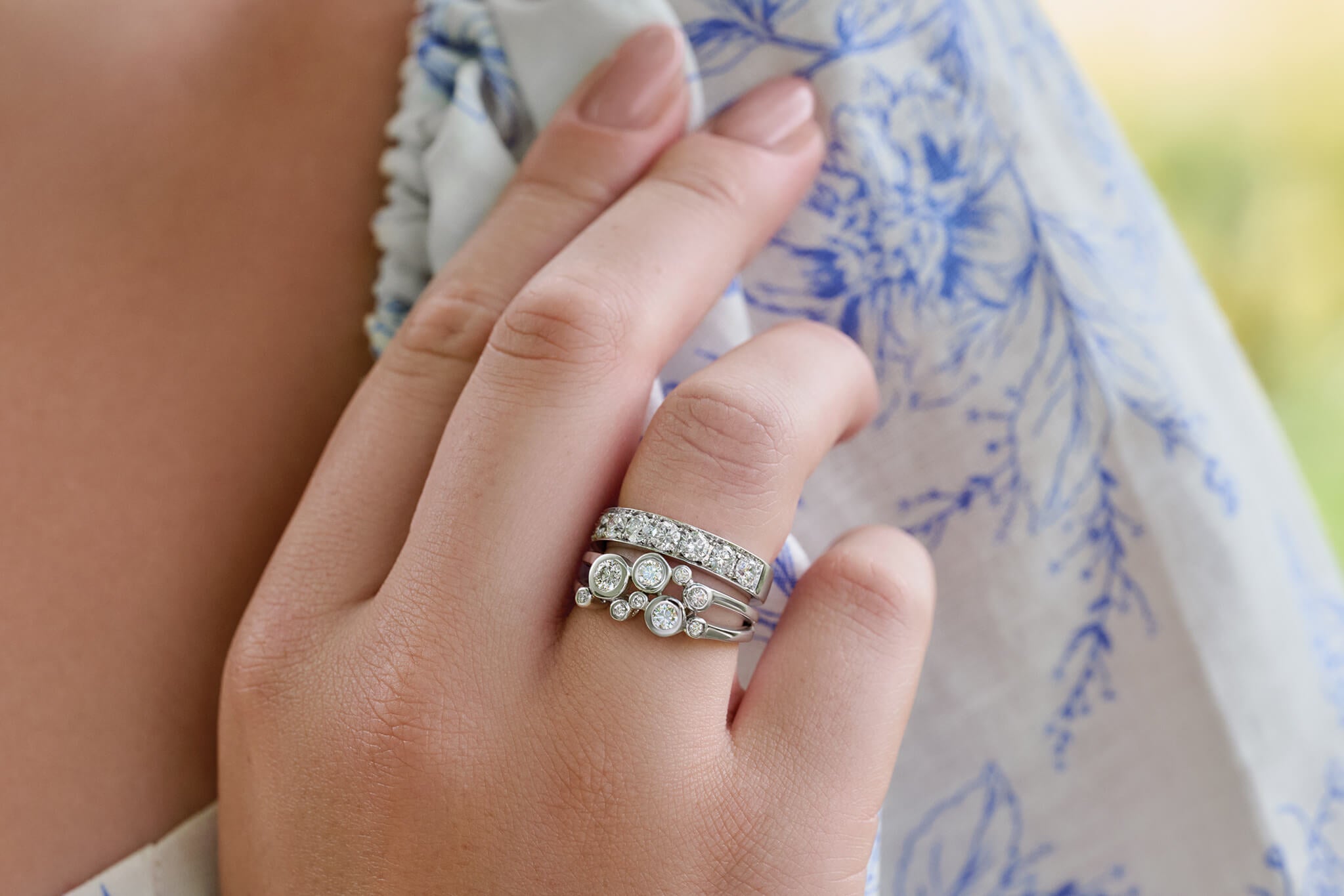 Model wearing Cirkel ring and eternity ring with diamonds