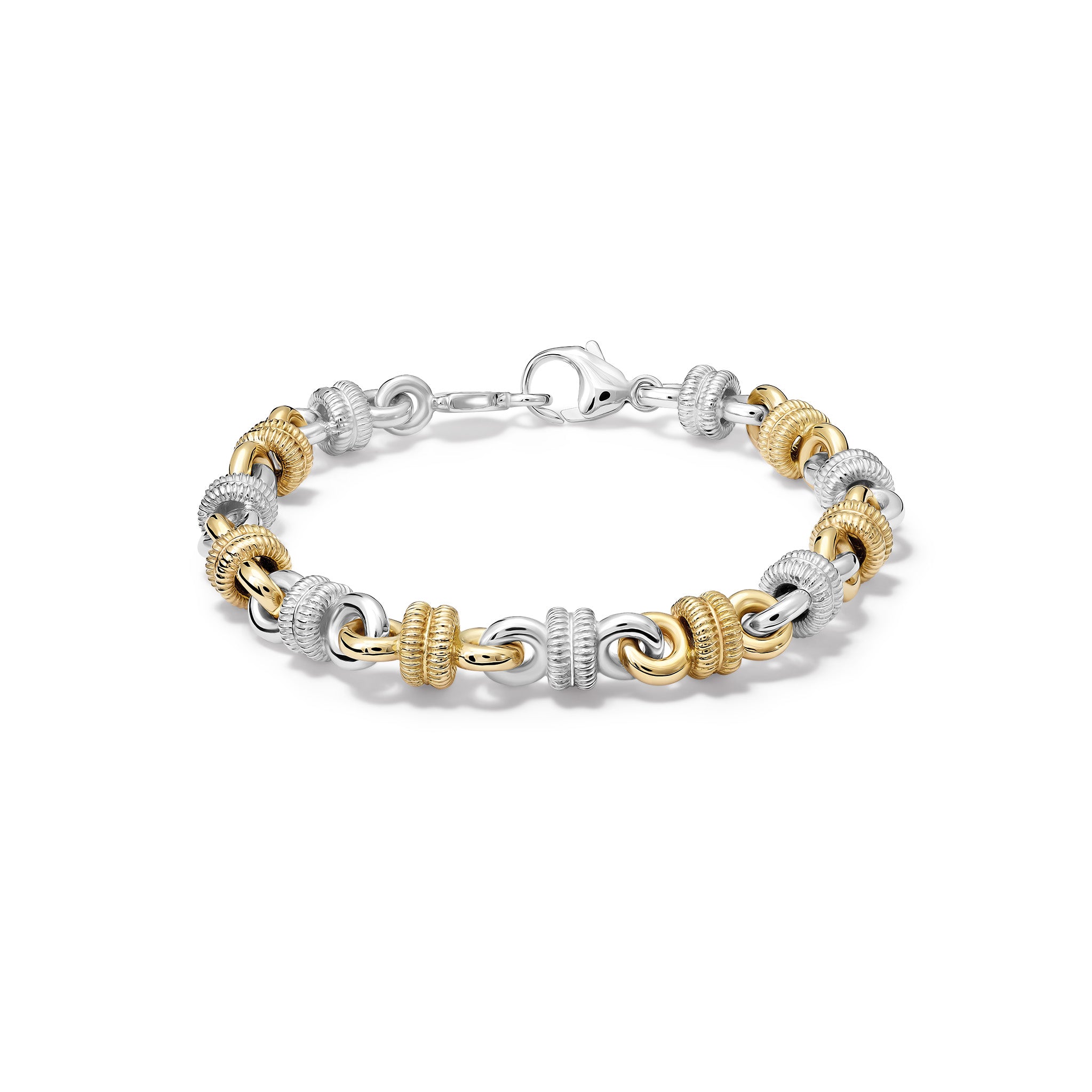 Handcrafted yellow gold and sterling silver bracelet featuring alternating textured metal links.