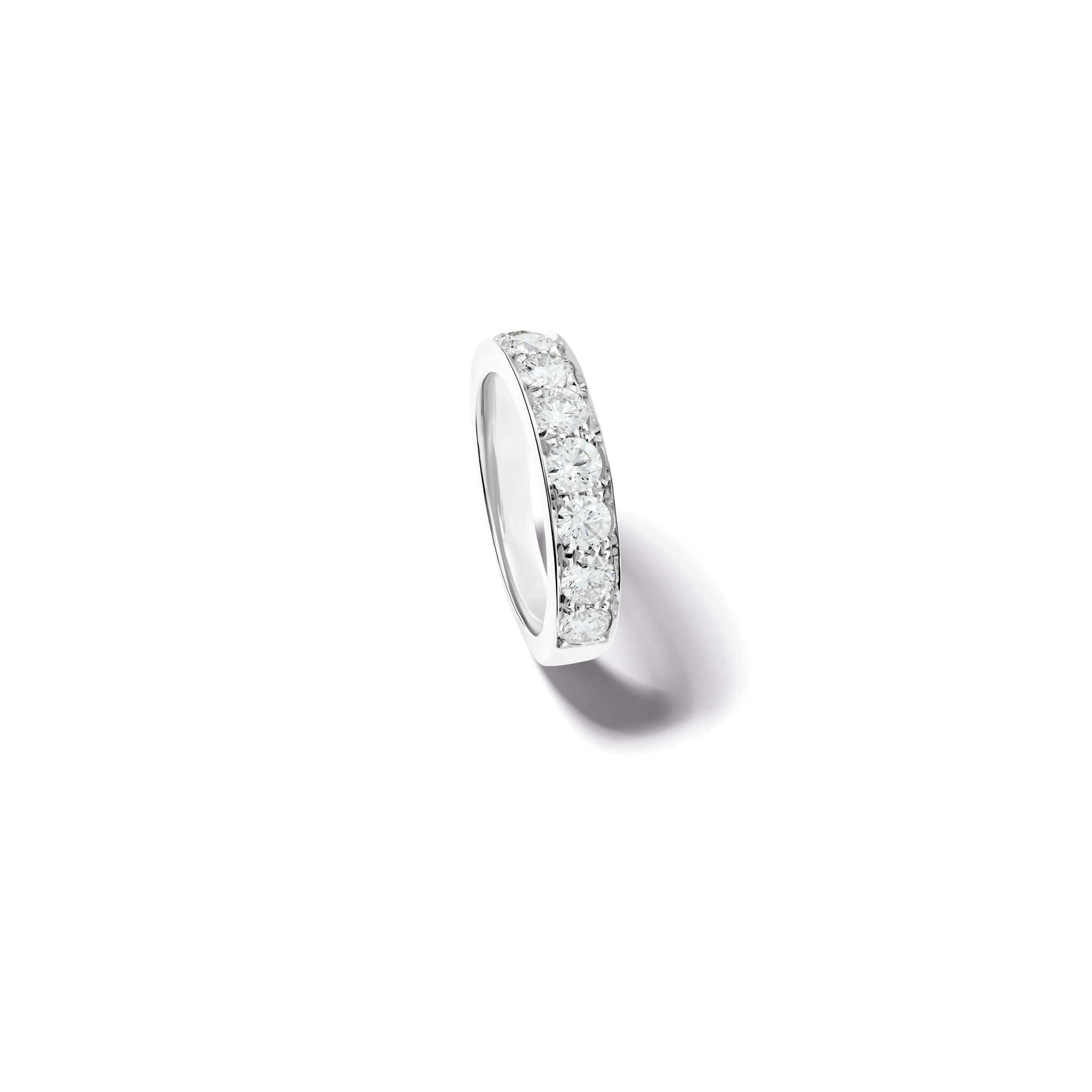 Handcrafted 18ct gold wedding band set with diamonds along half of the band.
