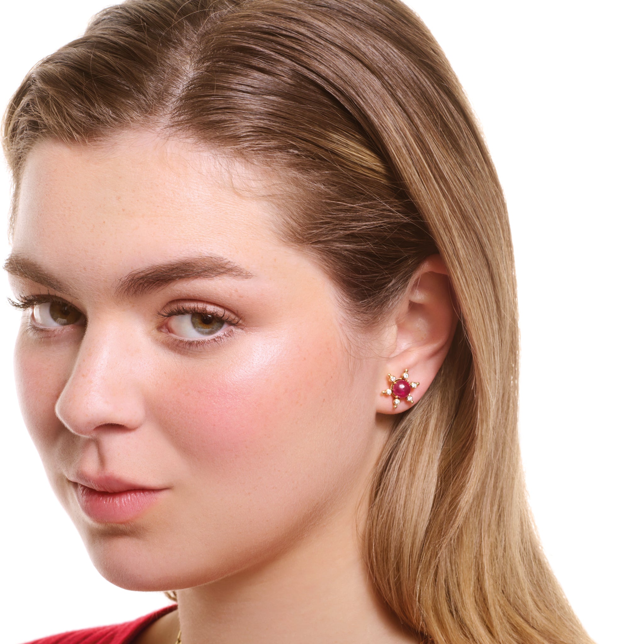 Model wearing handcrafted yellow gold earring halos inspired by a cactus, featuring six prongs, each set with a small diamond.