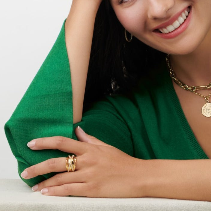 Model wearing a handcrafted 18ct white and yellow gold ring featuring a nest of tagliatelle with diamonds.