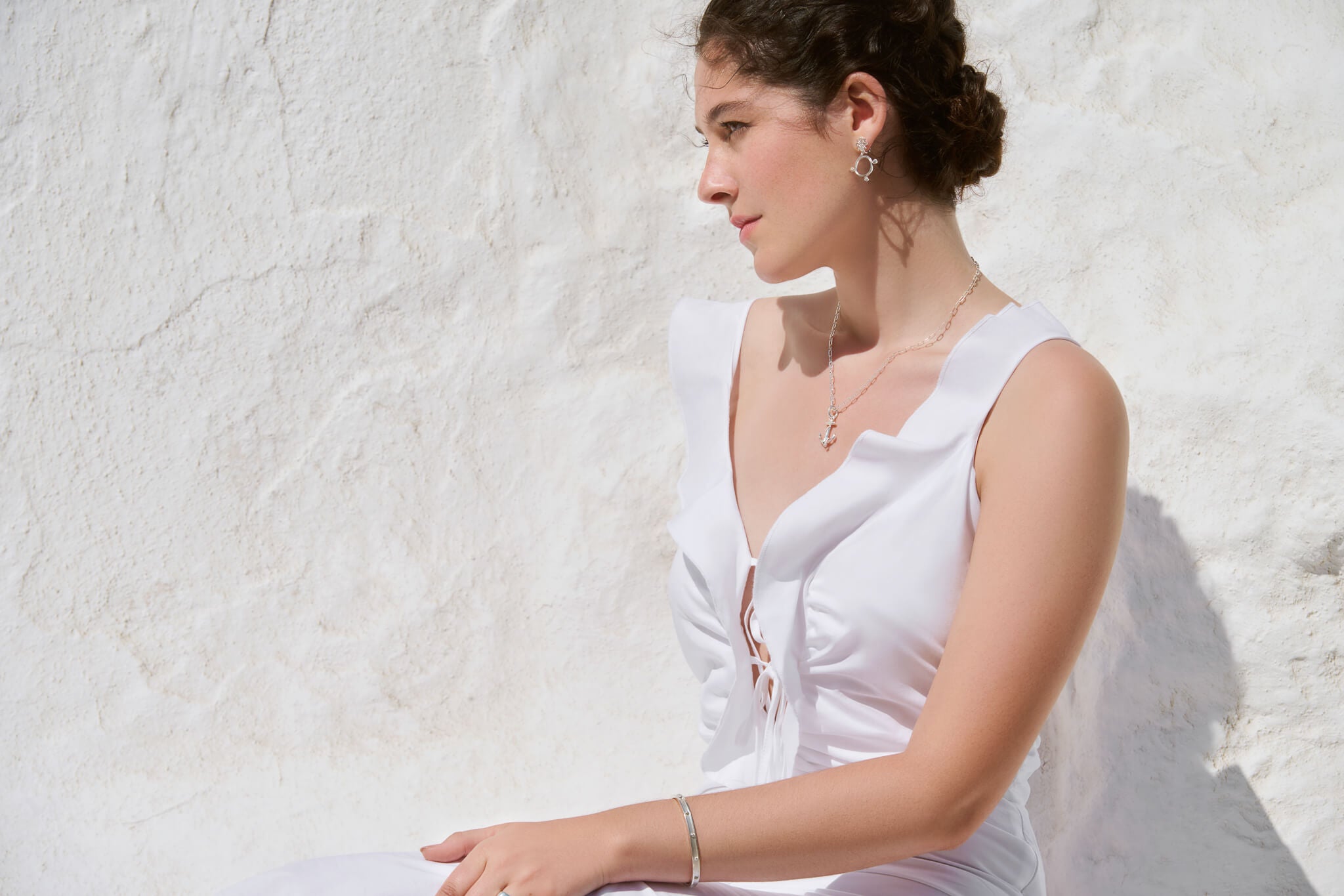 Model wears silver jewels in Greece