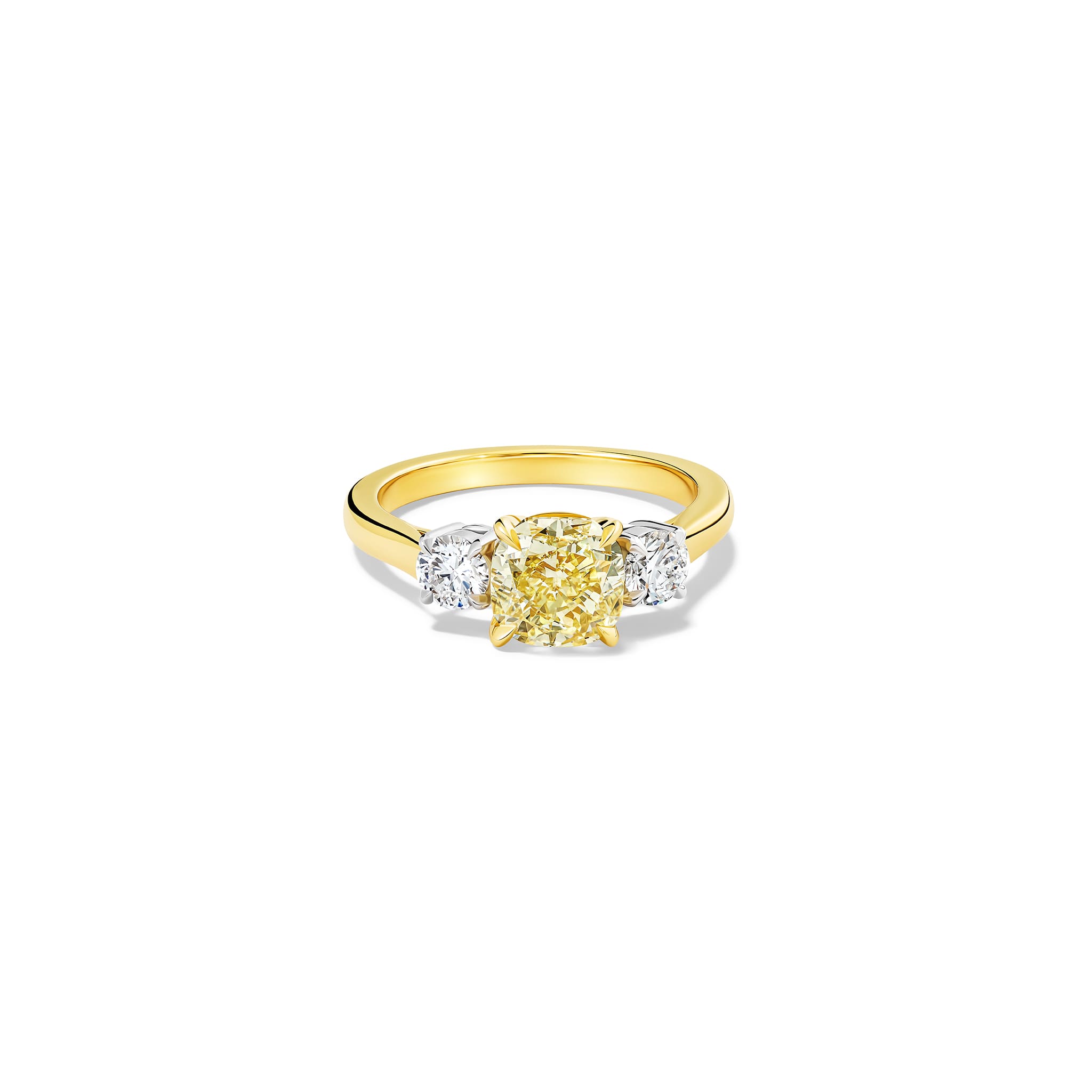 Handcrafted yellow gold yellow diamond engagement ring with two diamonds set in white gold on each side
