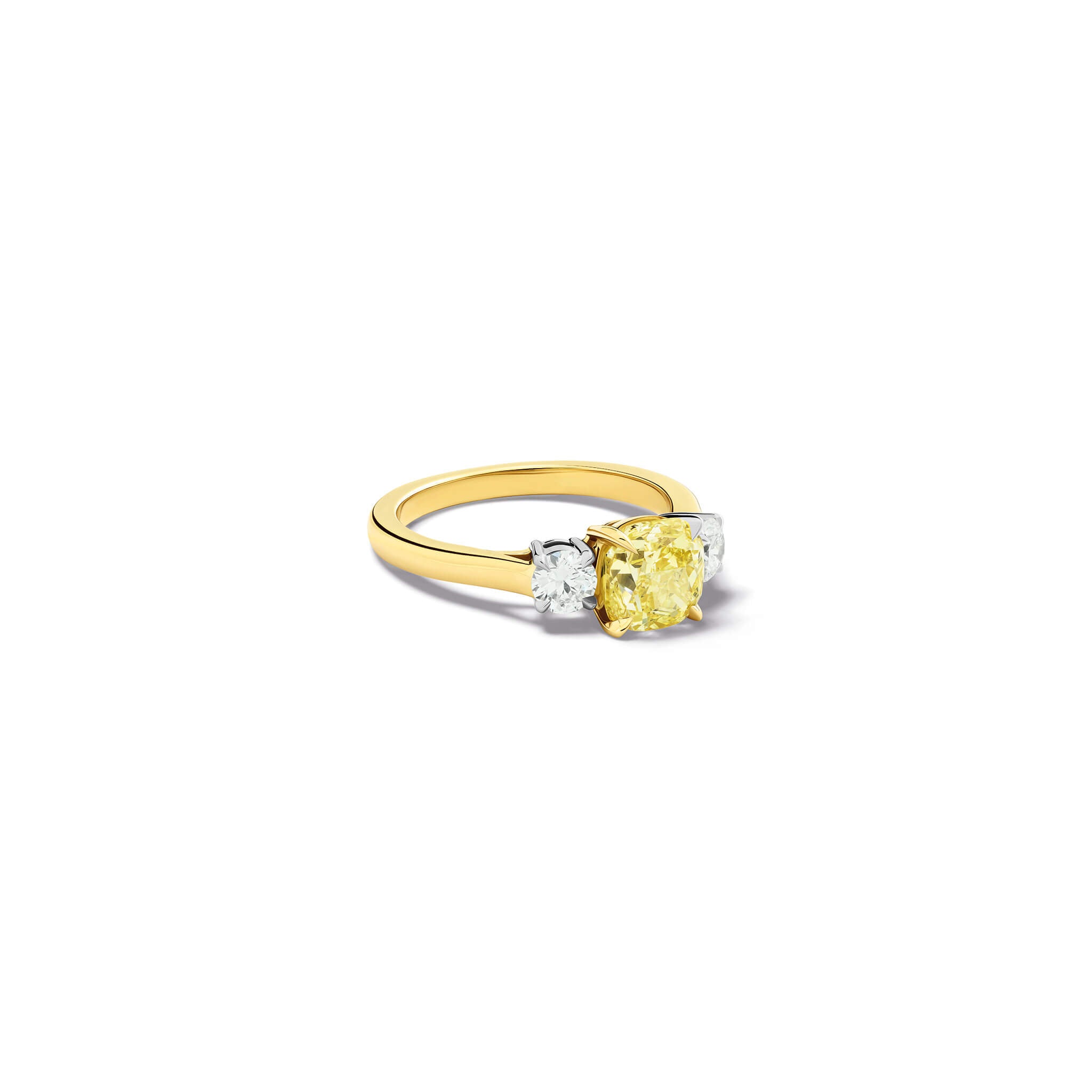 Handcrafted yellow gold yellow diamond engagement ring with two diamonds set in white gold on each side