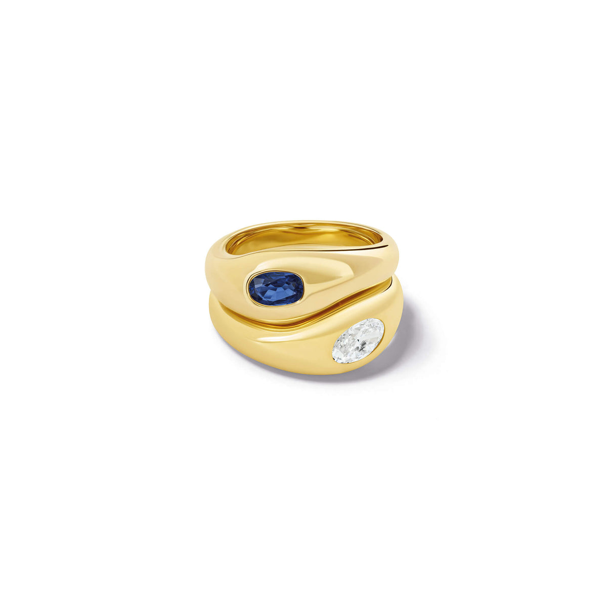 Two handcrafted yellow gold Duplus rings stacked together with sapphire and diamond.