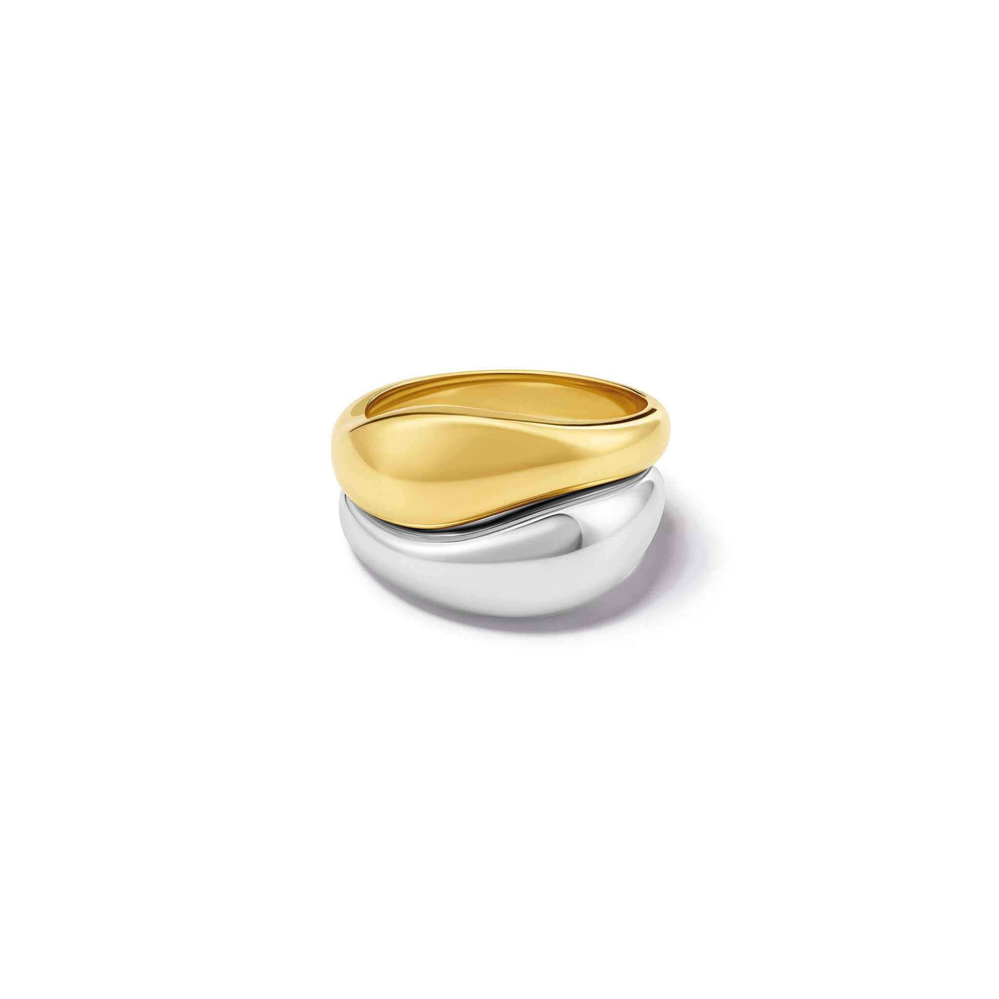 Handcrafted silver and yellow gold rings with a slight teardrop design at the top.