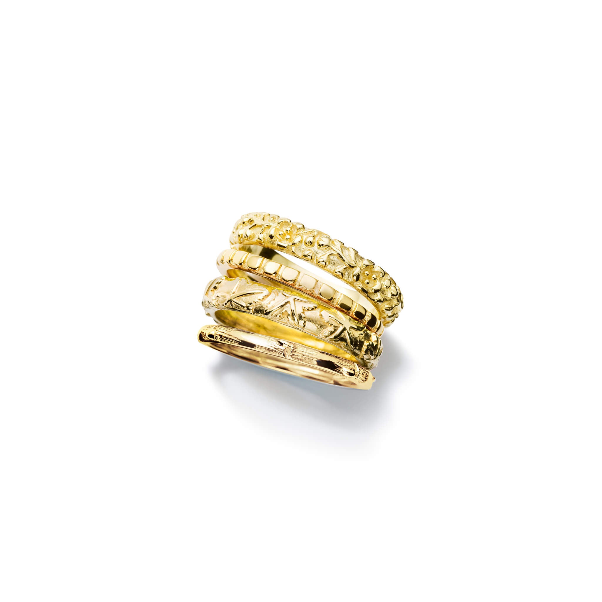 Handcrafted yellow gold rings designed with the intricate pattern and texture of the seasons in Japan.