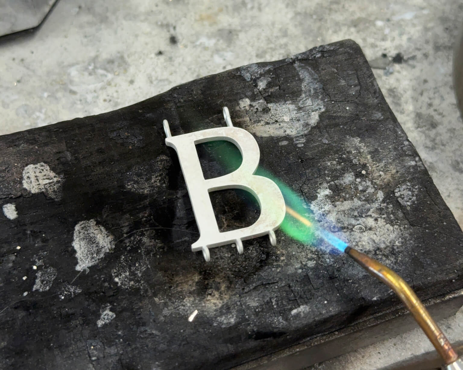 Anne Boleyn 'B' necklace crafted by hand in Cassandra Goad's London workshop