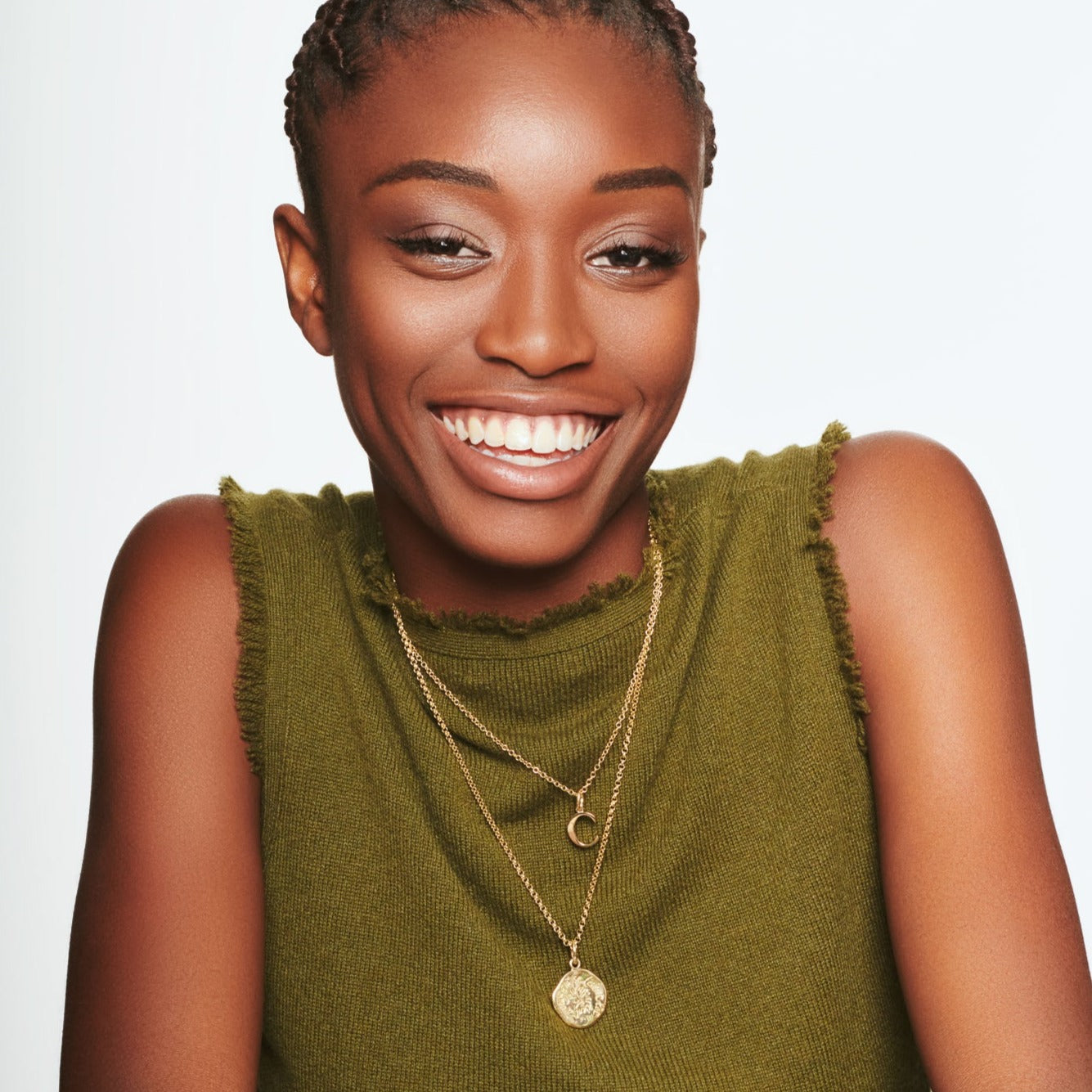 Model wearing a handcrafted 18ct yellow gold necklace pendant engraved with a quote.