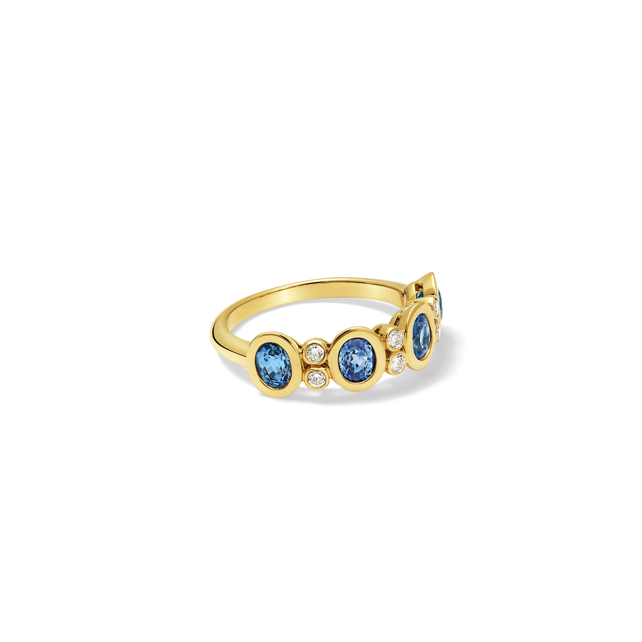 Handcrafted Imara half-eternity ring in 18ct yellow gold with oval cut blue sapphire and diamond, September birthstone