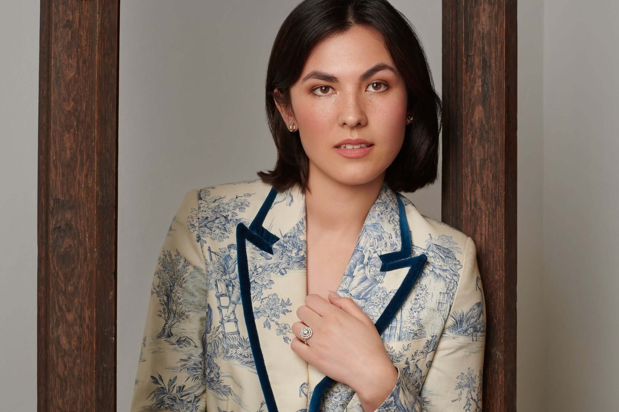 Model wearing a handcrafted 18ct white gold engagement ring with diamonds.
