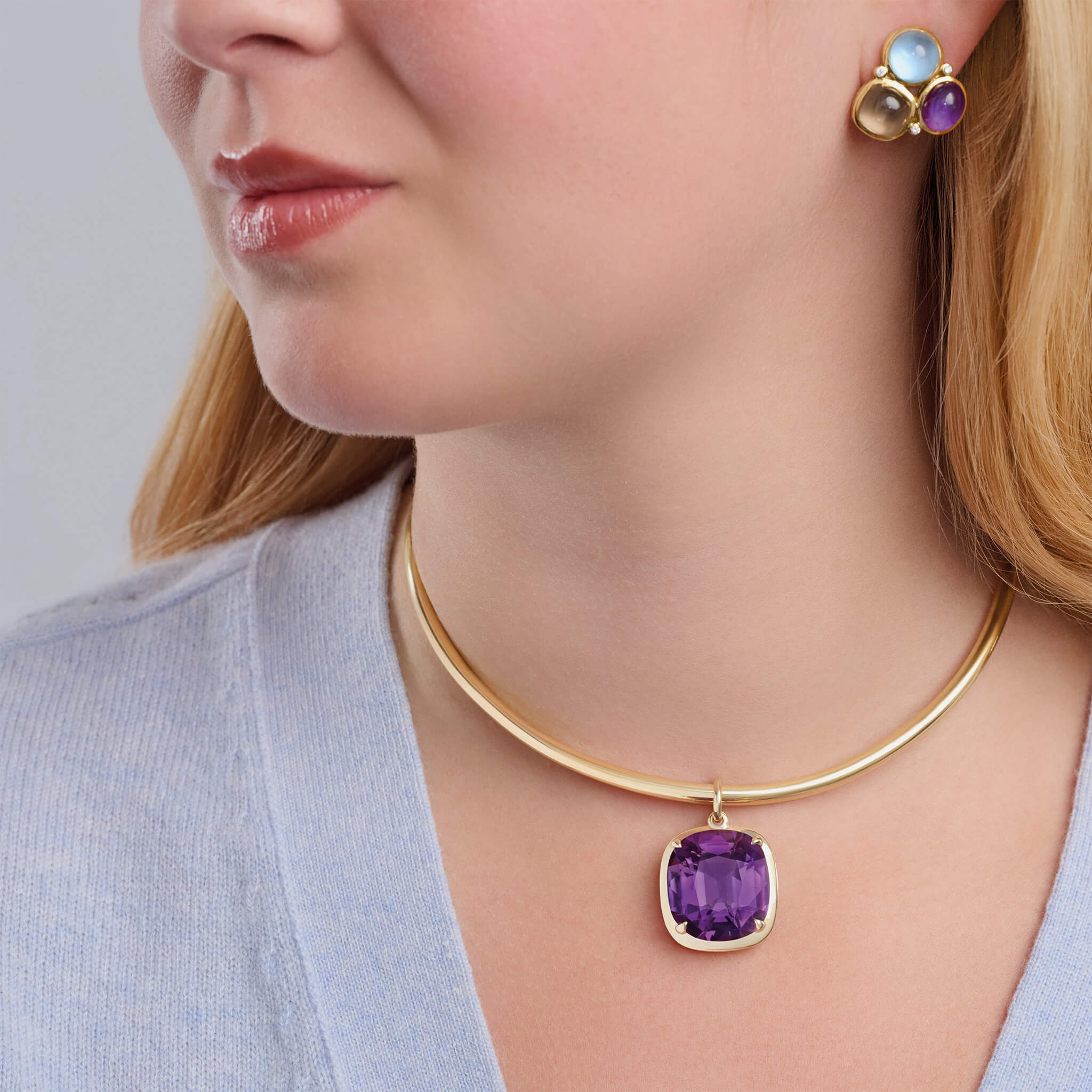 Model wears handcrafted 9ct yellow gold necklace pendant with amethyst, february birthstone