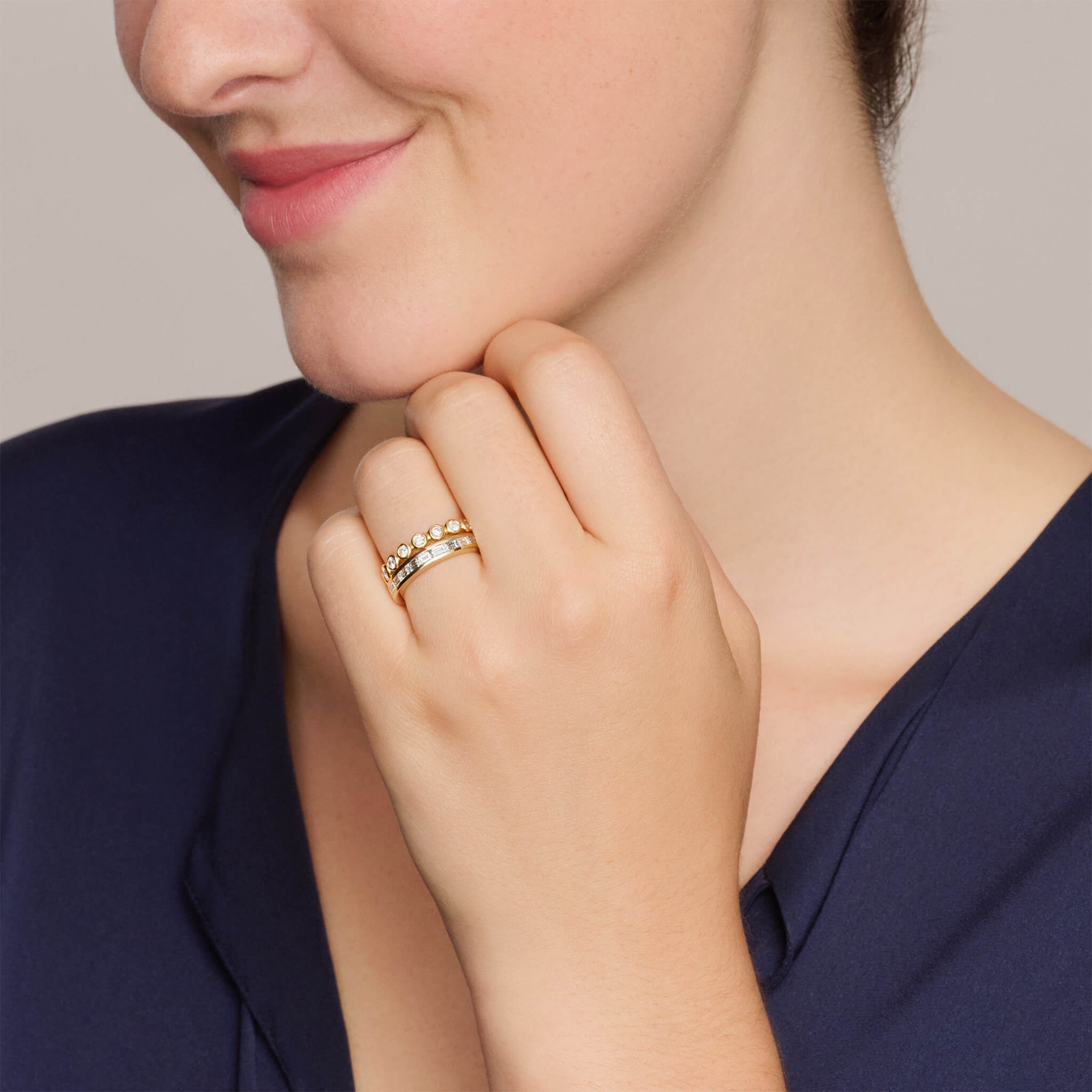 Model wearing handcrafted 18ct gold half eternity ring with diamonds.