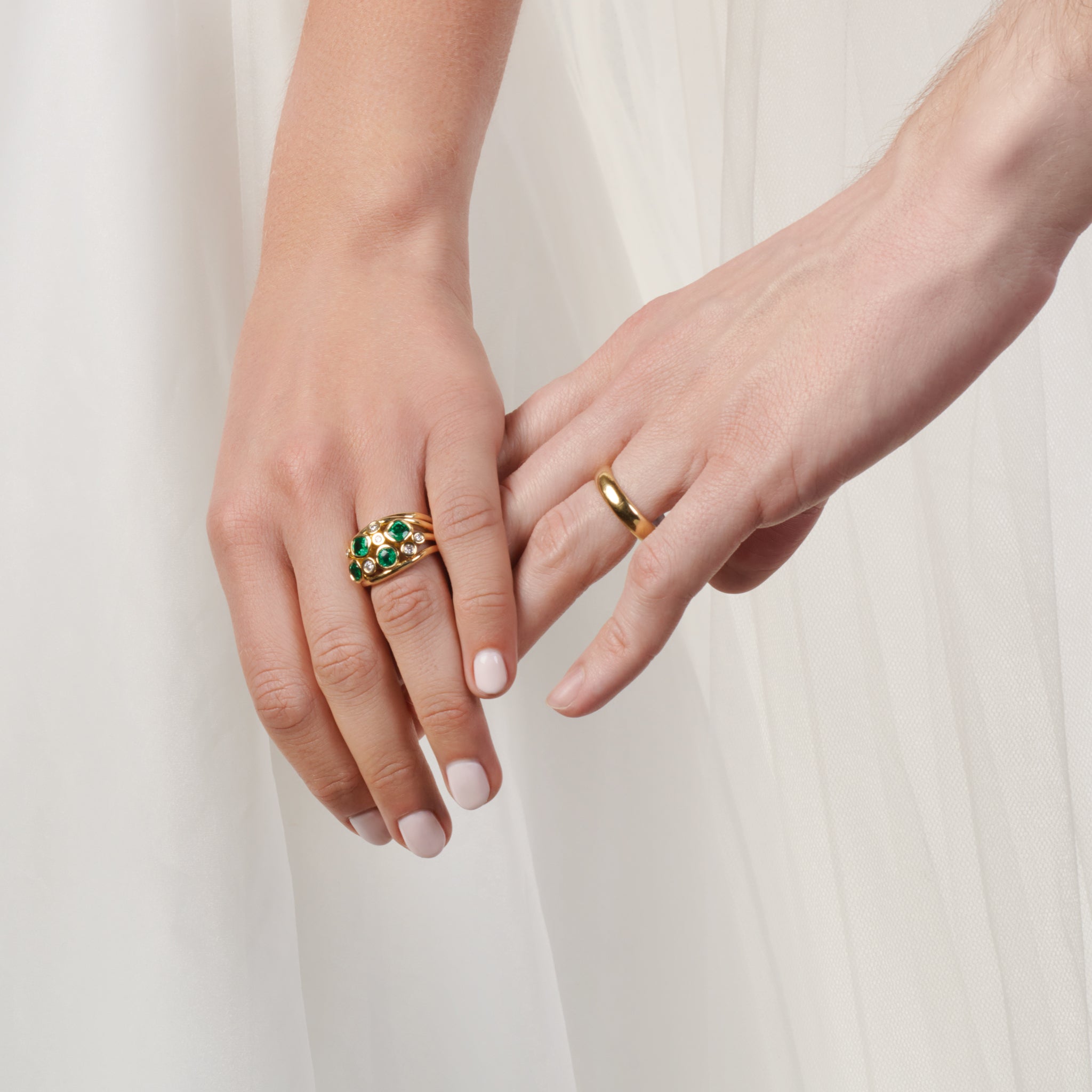 Model wearing a handcrafted 18ct yellow gold wedding band with a width of 4mm.