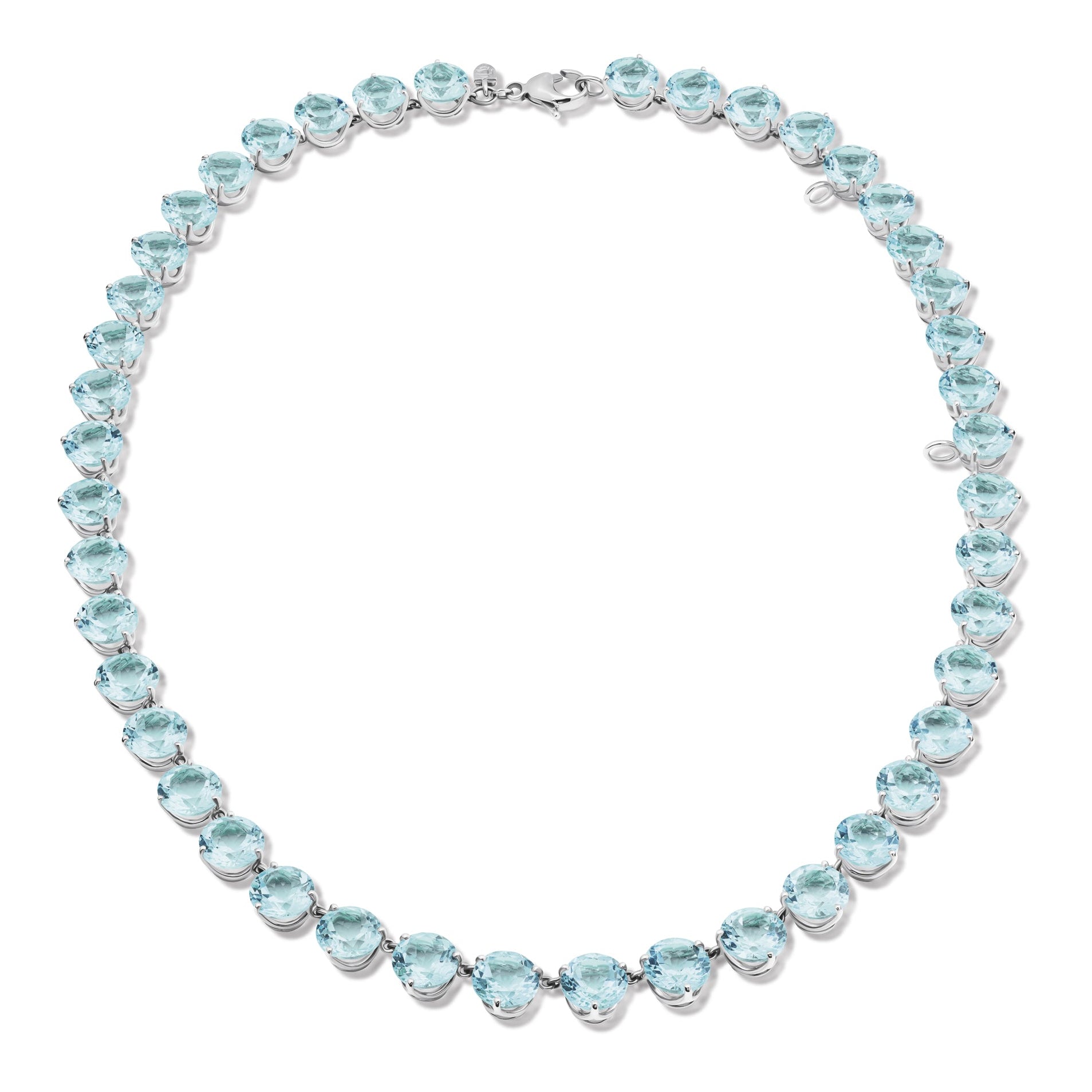 Handcrafted white gold necklace featuring circular blue topaz gemstones.
