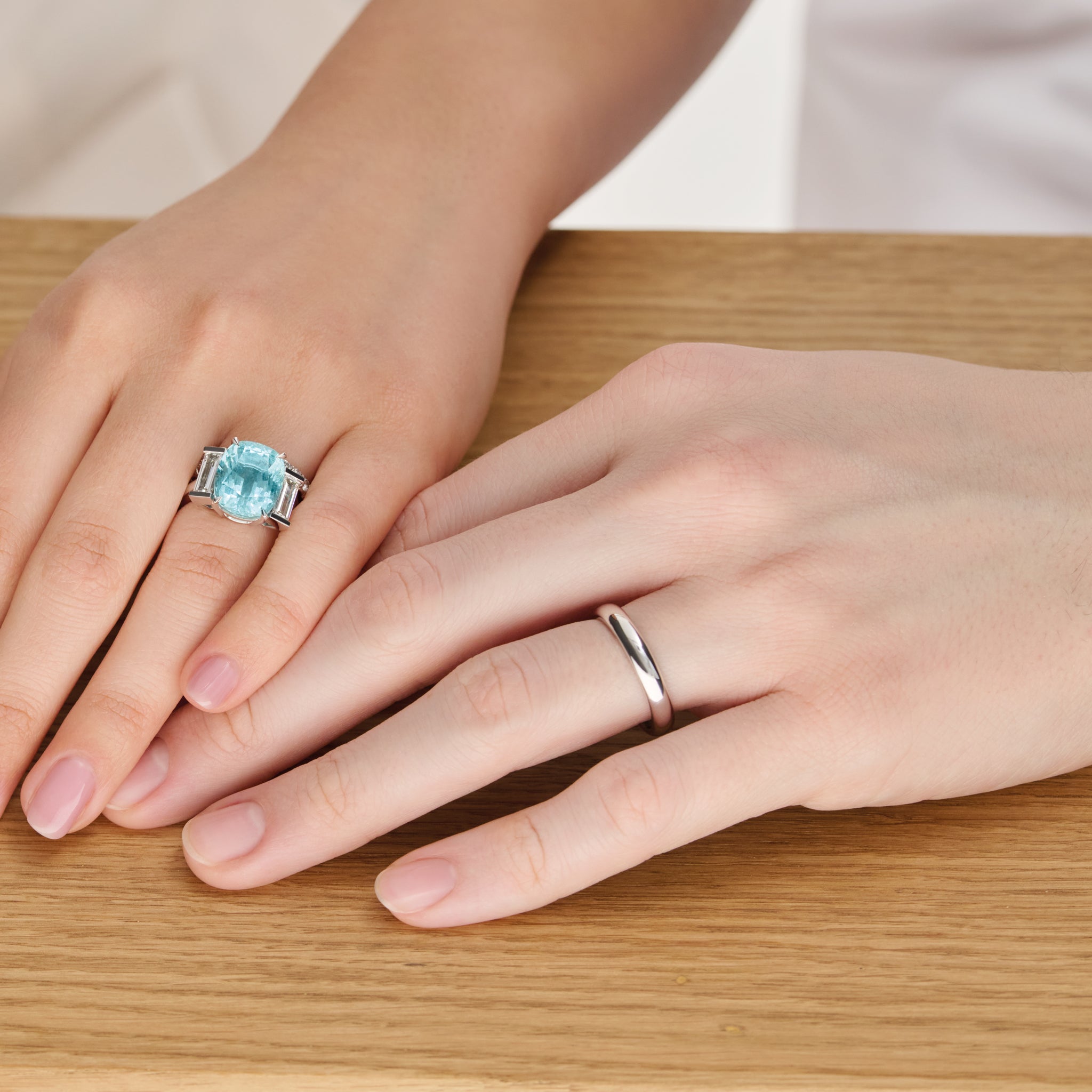 Model wearing a handcrafted 18ct white gold wedding band with a width of 4mm.