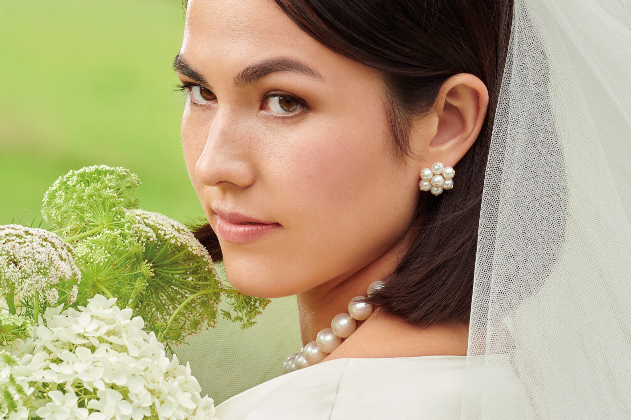 Model wearing handcrafted pearl jewellery, perfect for a bride on their wedding day.