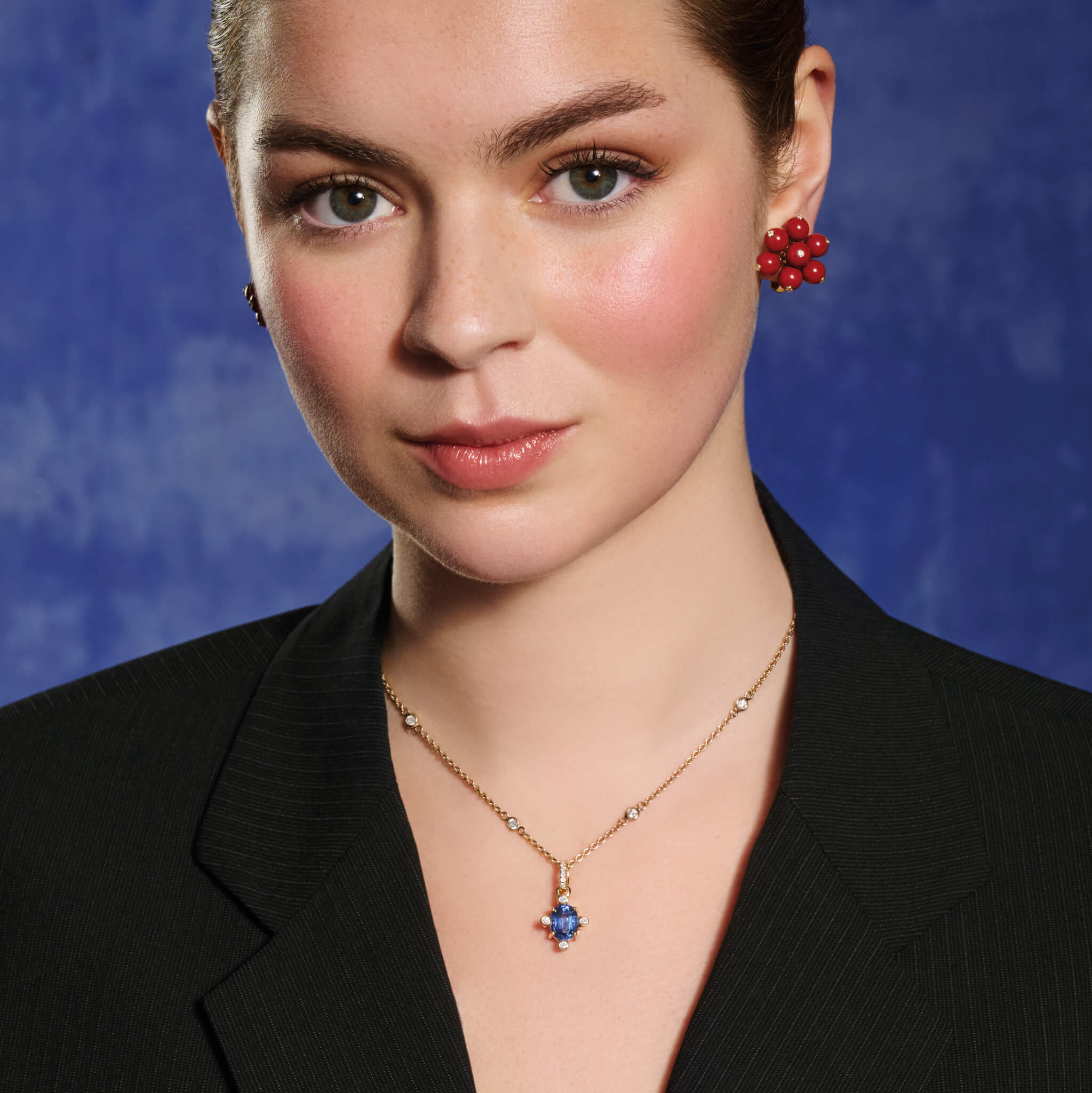 Model wears handcrafted 18ct yellow gold Compass pendant with kyanite set with four diamonds and a yellow gold diamond pav? loop.