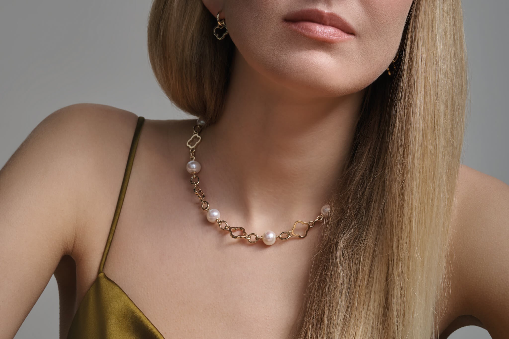 Model wears Star Anise necklace and earrings inspired by Cassandra's travels in China.