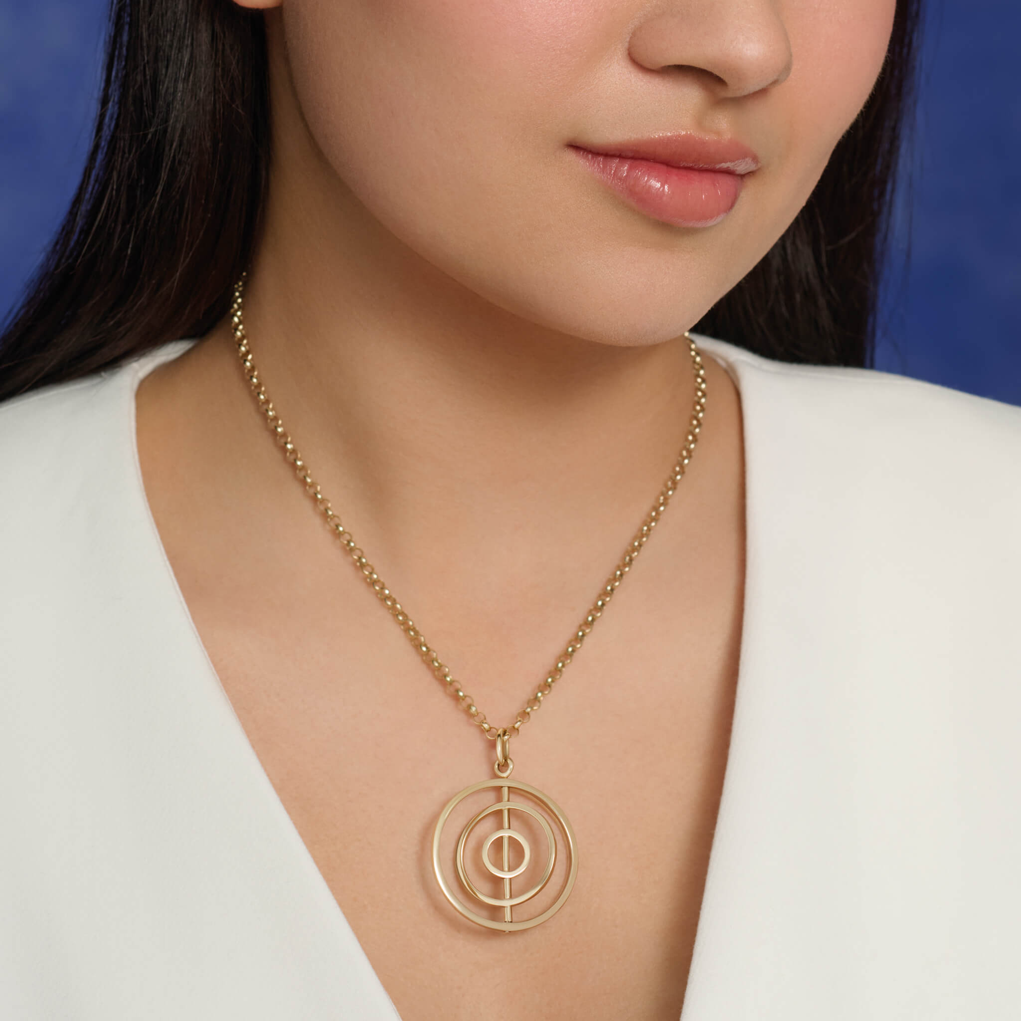 Handcrafted Gyroskop pendant, the circles of the Gyroskop design spin around the central axis of the pendant.