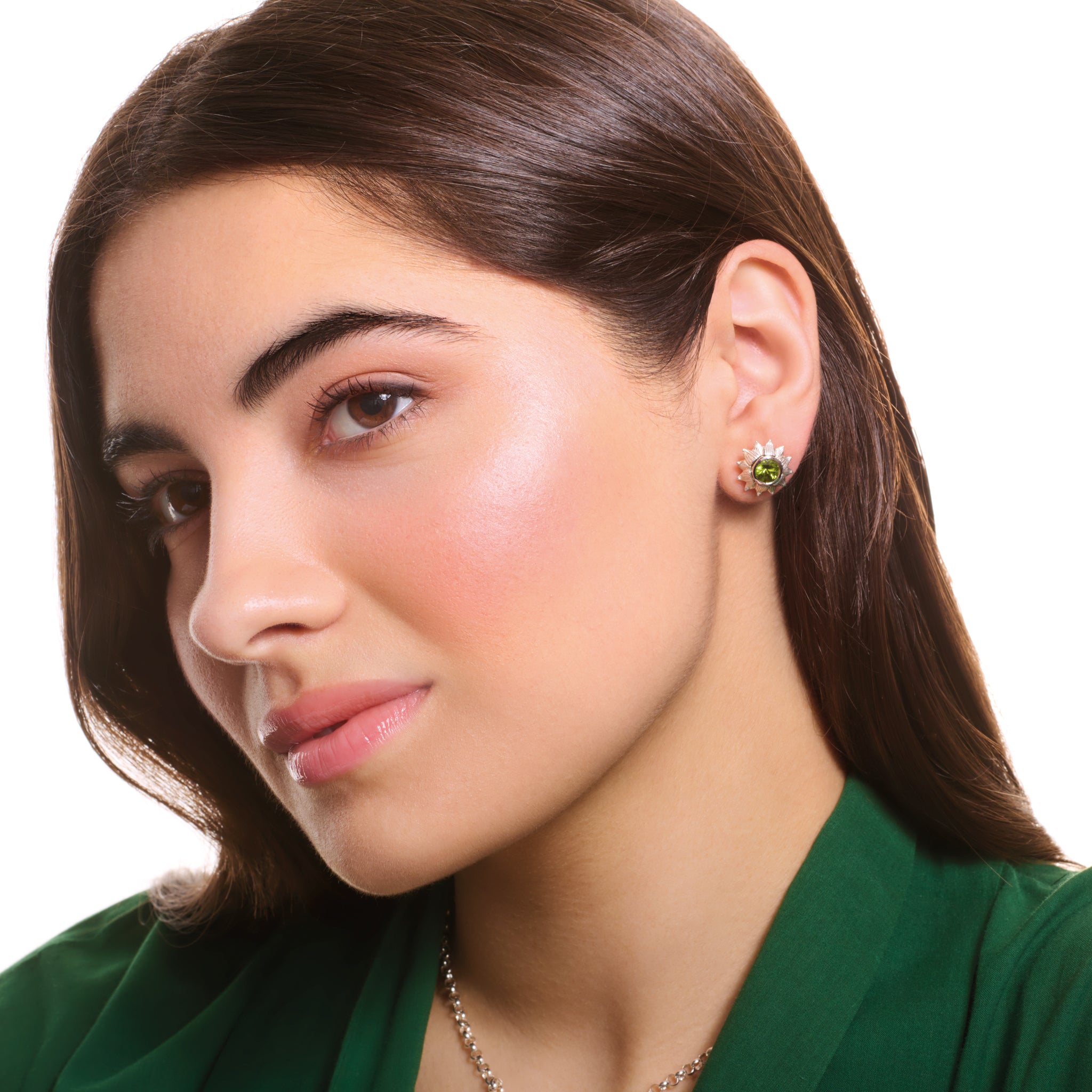 Model wearing handcrafted sterling silver earring halos shaped as a sunflower.