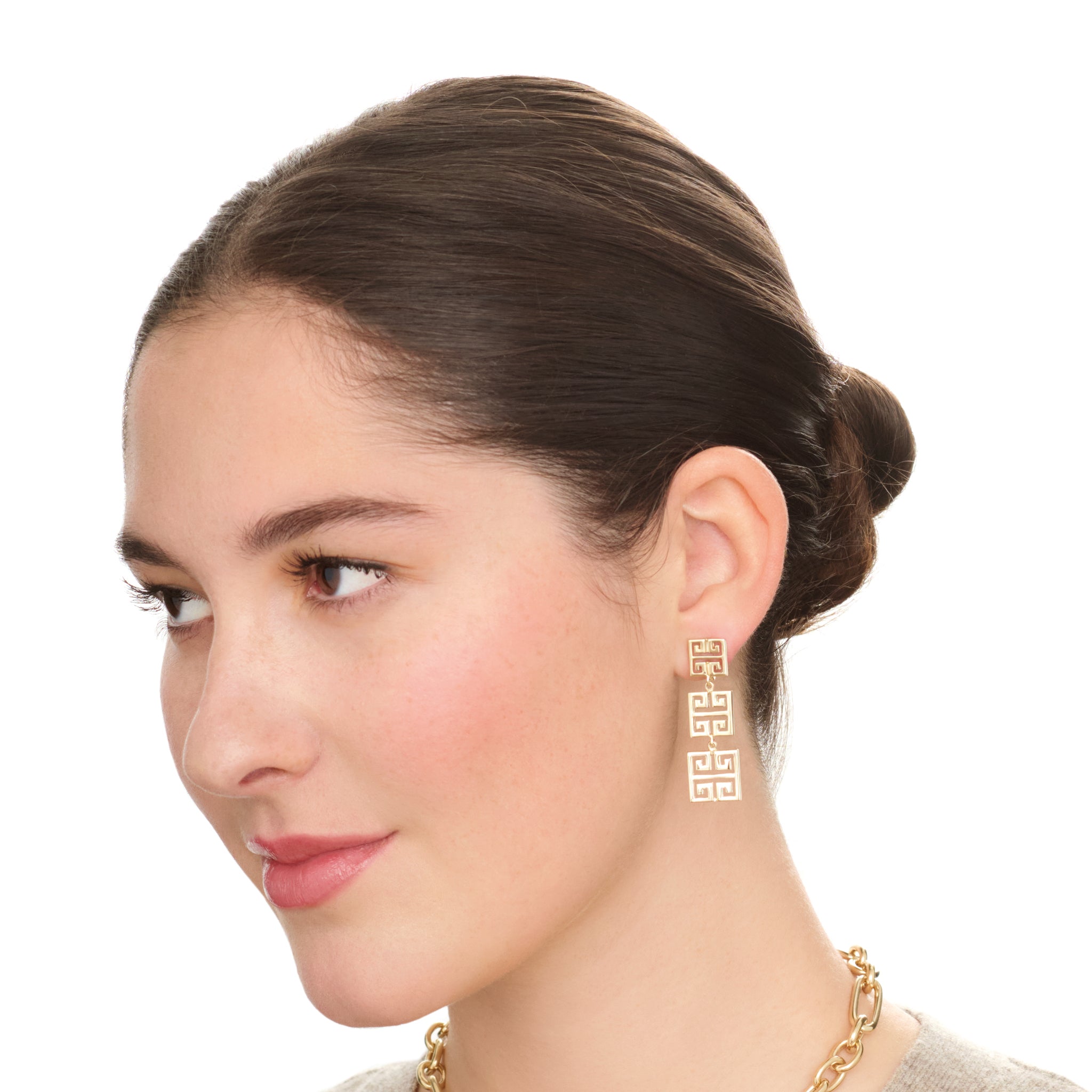 Model wearing handcrafted and 9ct yellow gold mixed triple earring with square shapes drops with iconic symmetrical Greek motif.