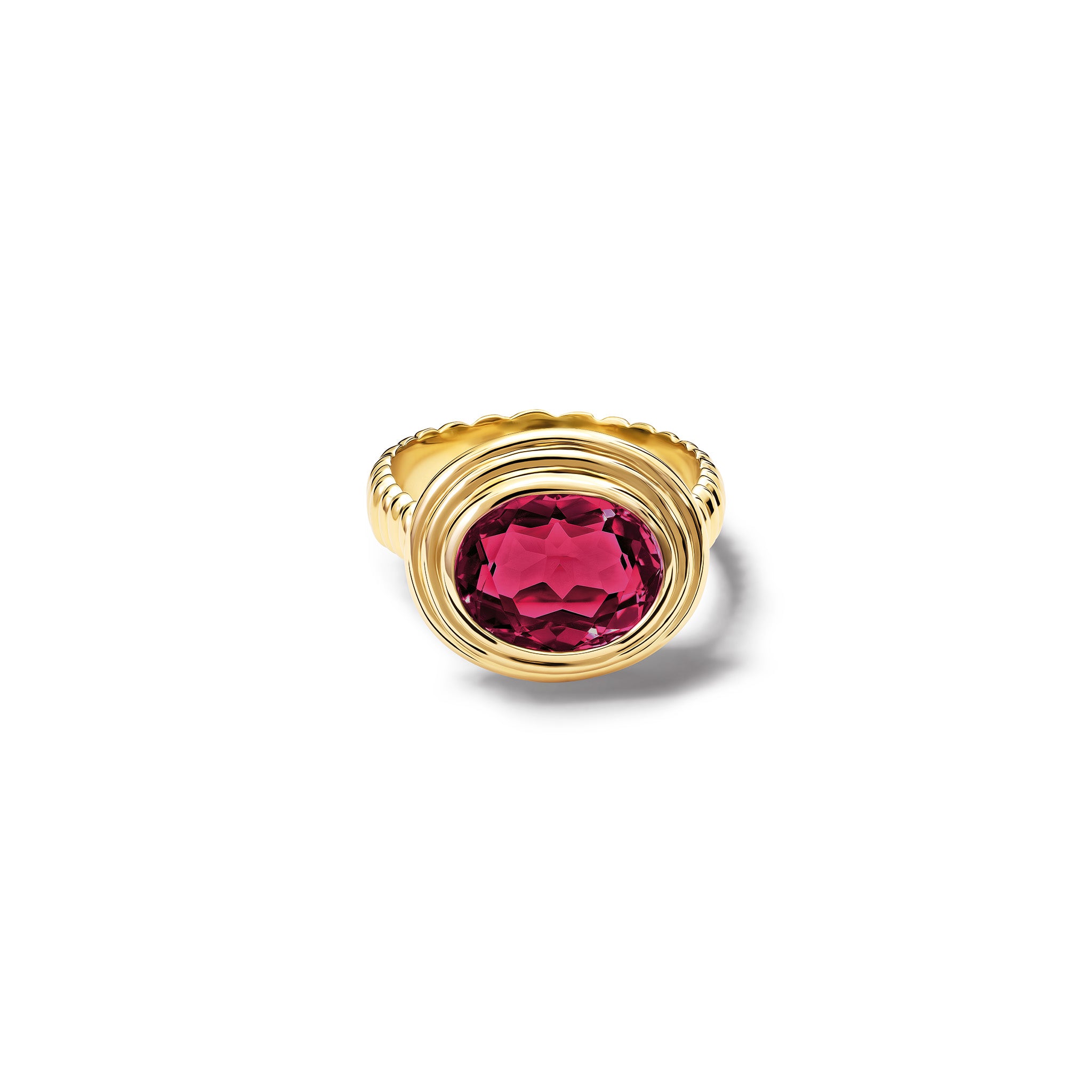 Handcrafted yellow gold ring featuring a prominent oval rhodolite garnet, birthstone of January.