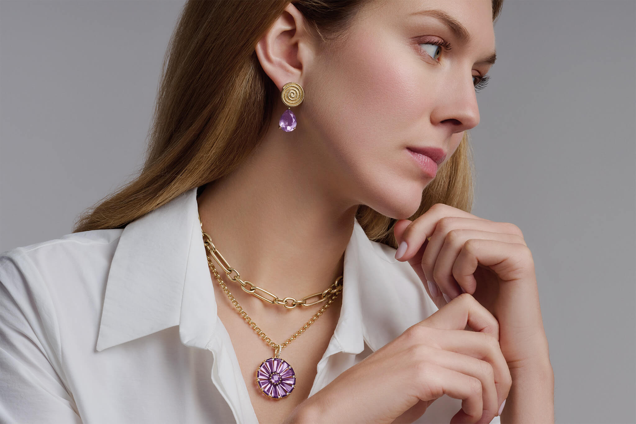 Model wearing amethyst Roi Soleil pendant and earring drops, the birthstone of February.