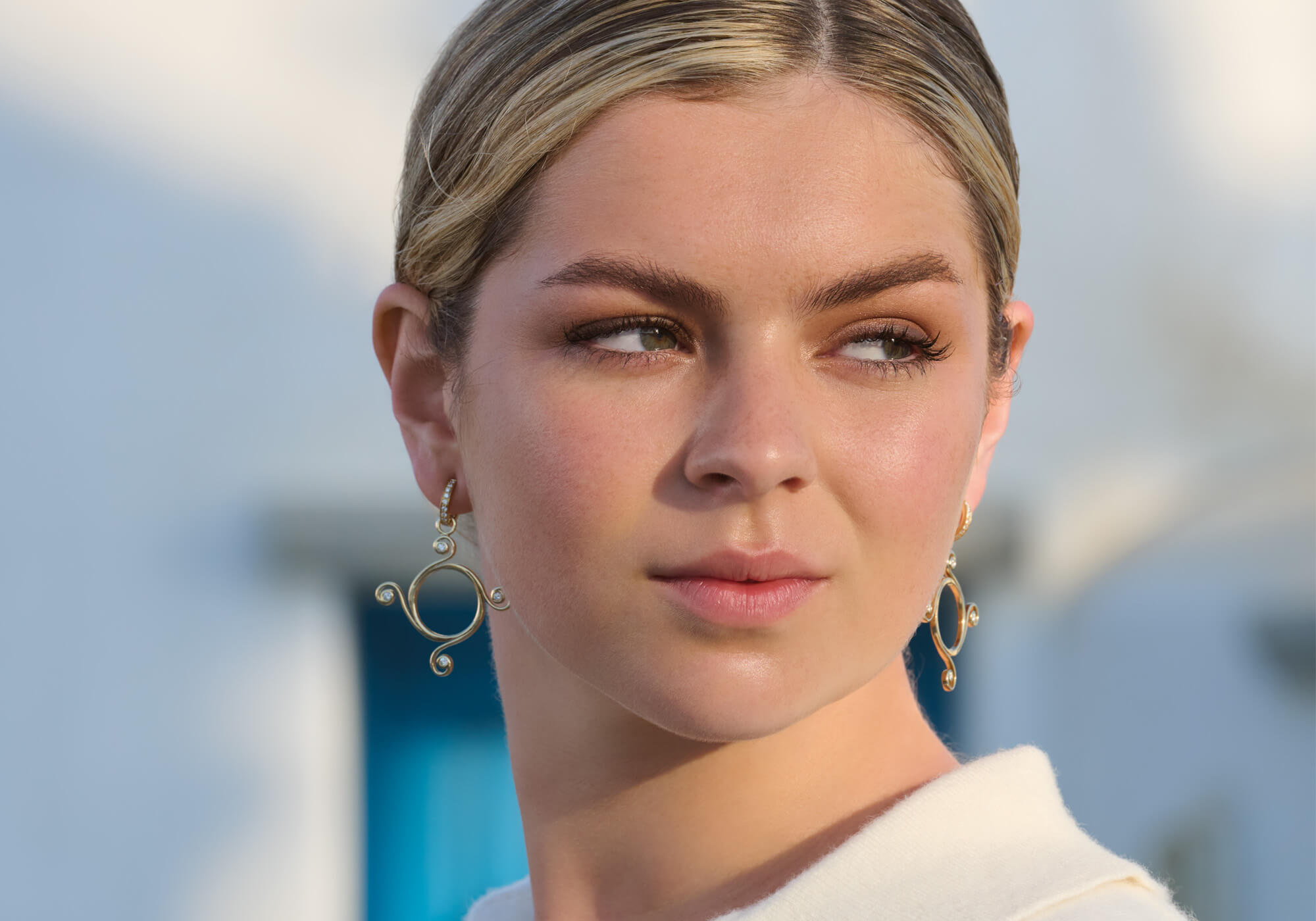 Model wearing Athena earring drops