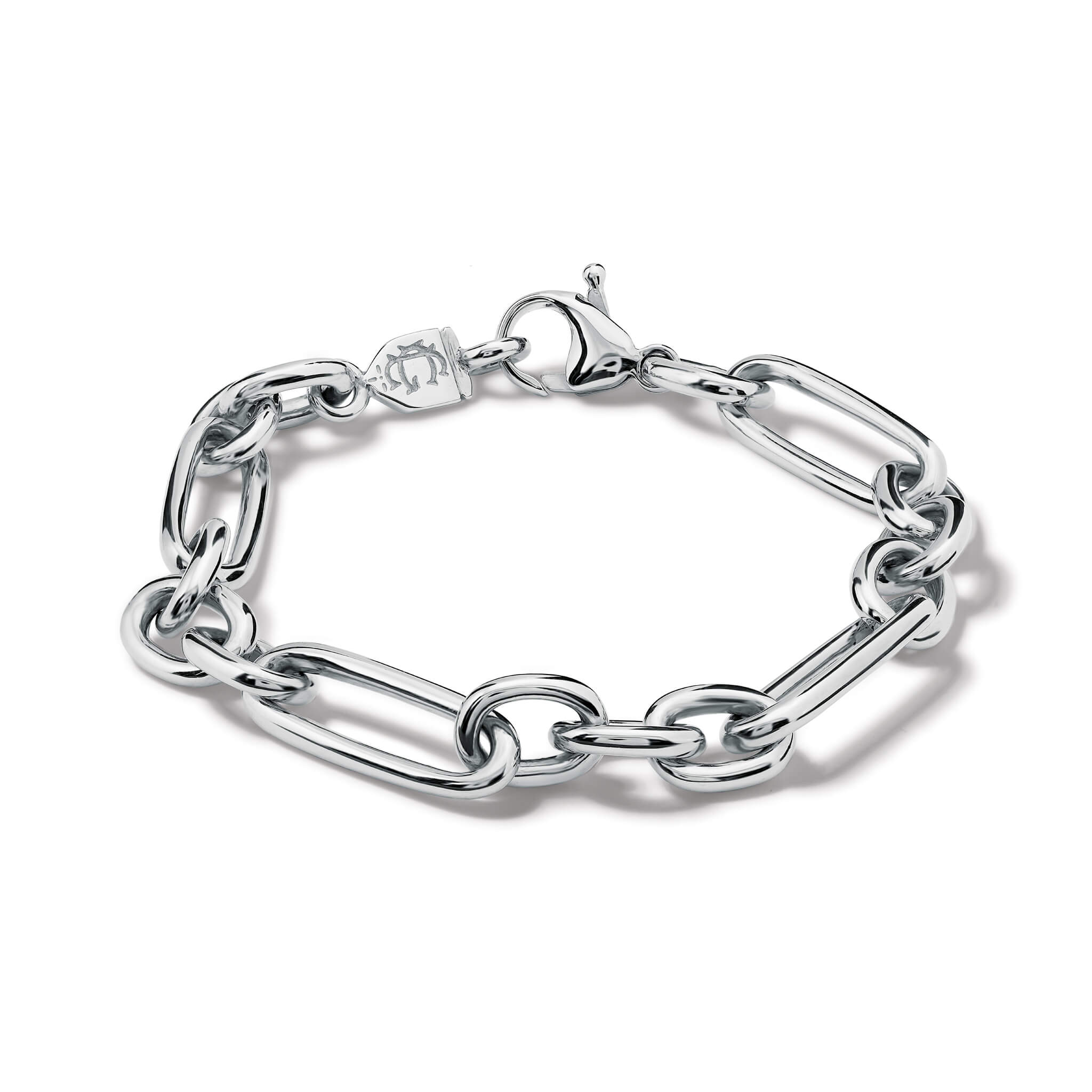 Handcrafted silver link bracelet featuring chunky round and rounded rectangular links interconnected.