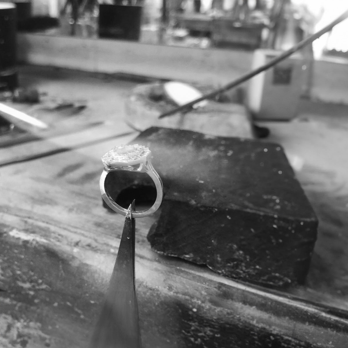 An engagement ring being meticulously crafted in a London jewellery workshop.