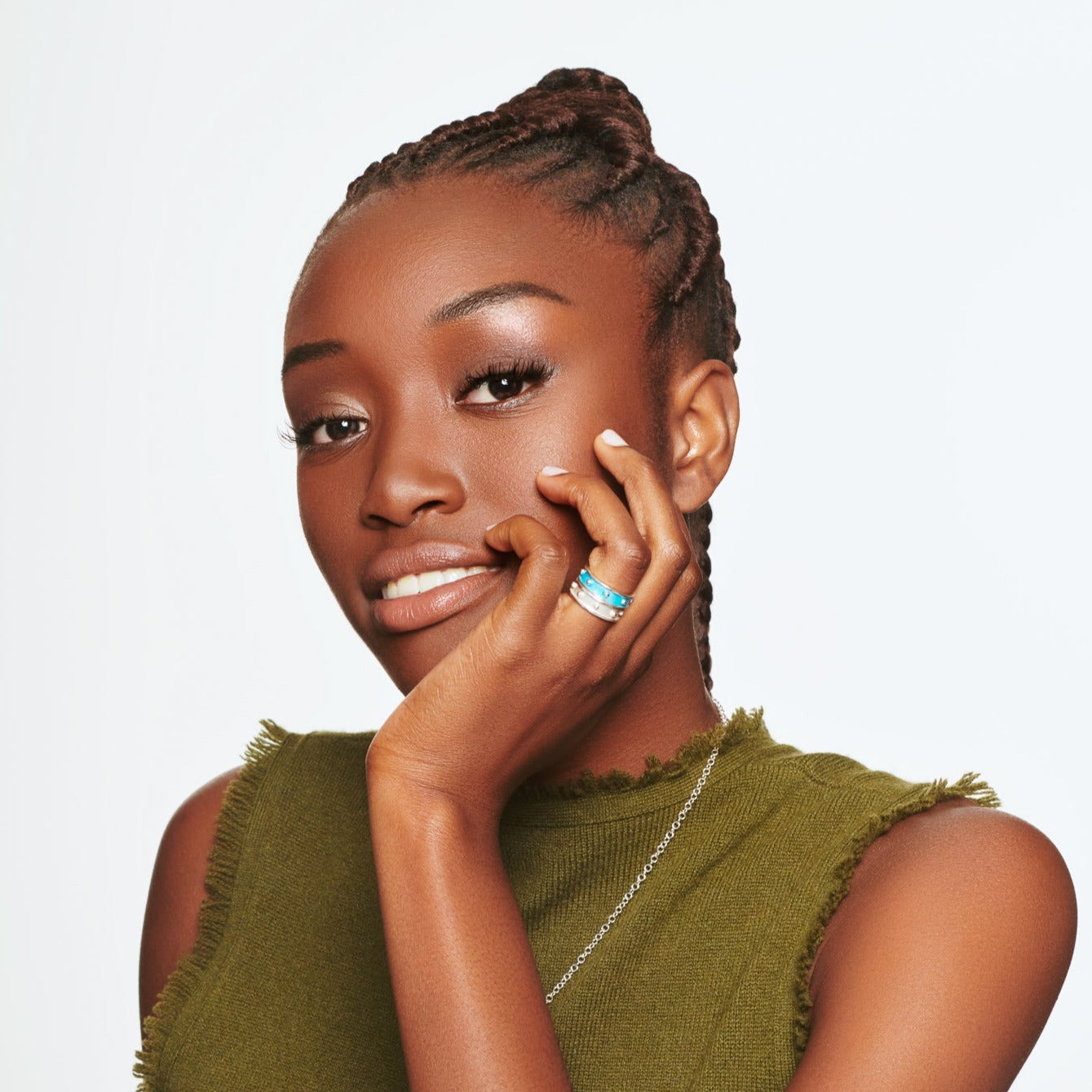 Model wearing a handcrafted sterling silver ring with evenly spaced, protruding round dots.
