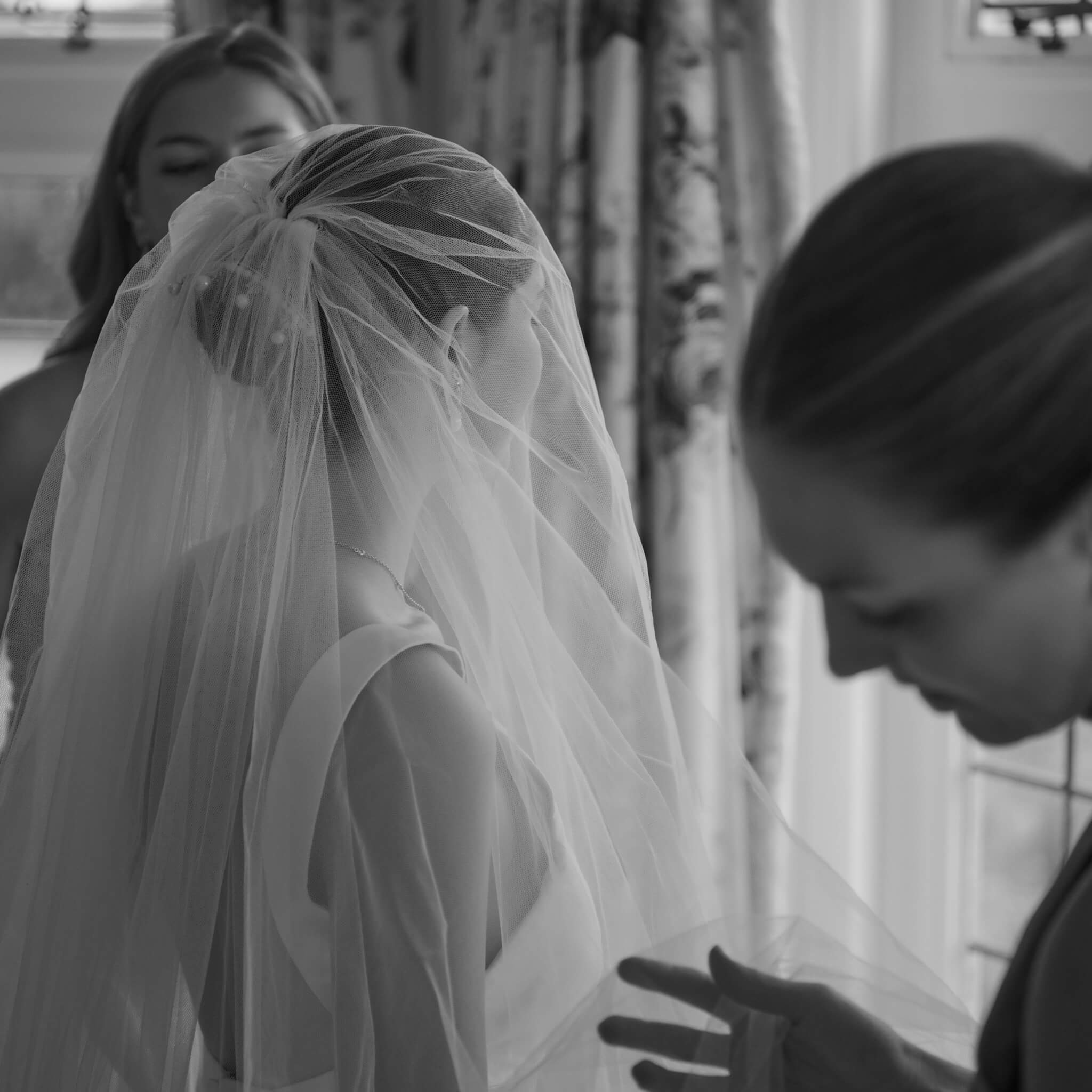 bride getting ready with bridesmaids wearing cassandra goad bridal jewellery