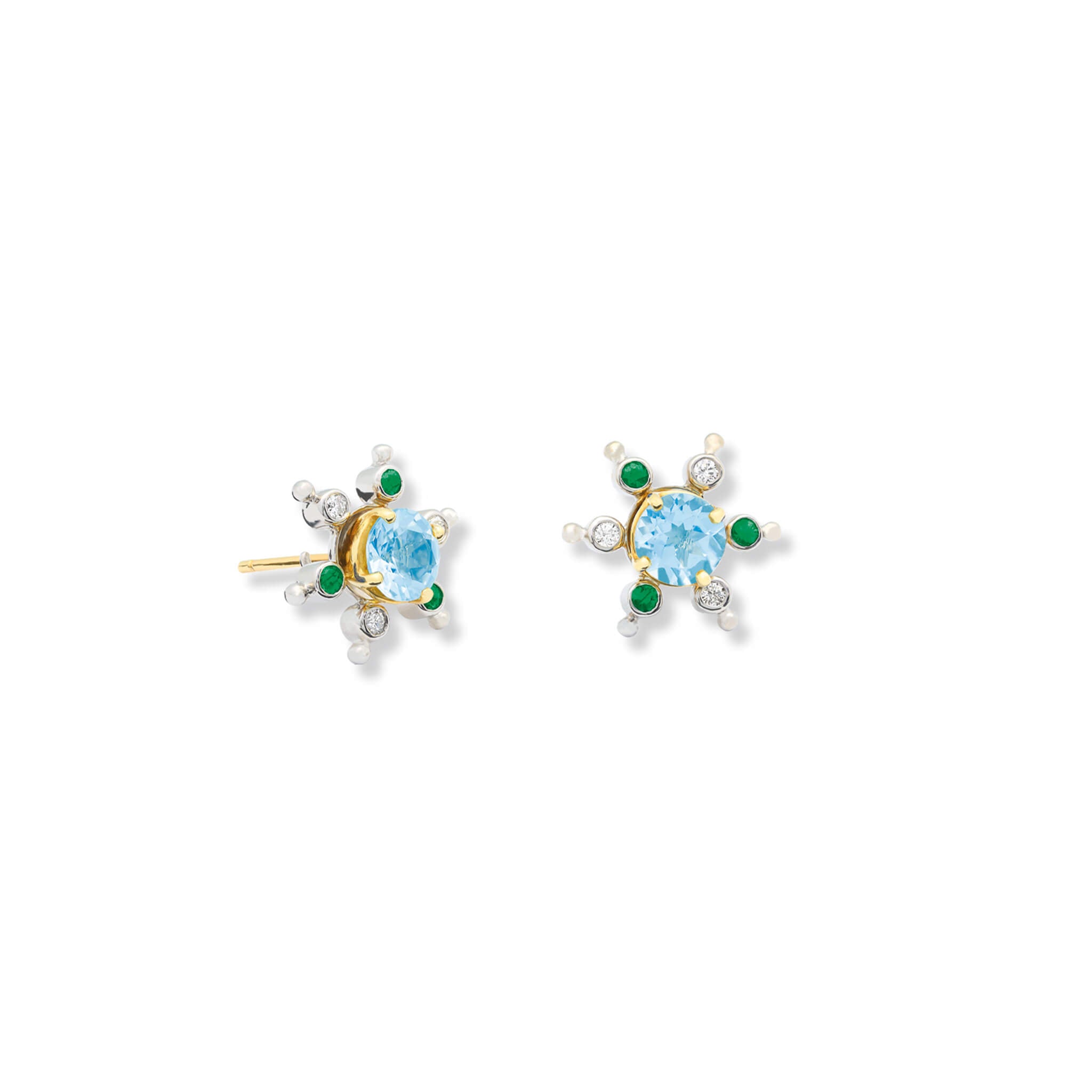 Model wears handcrafted white gold earring halos inspired by a cactus, featuring six prongs, set small emerald and diamond.