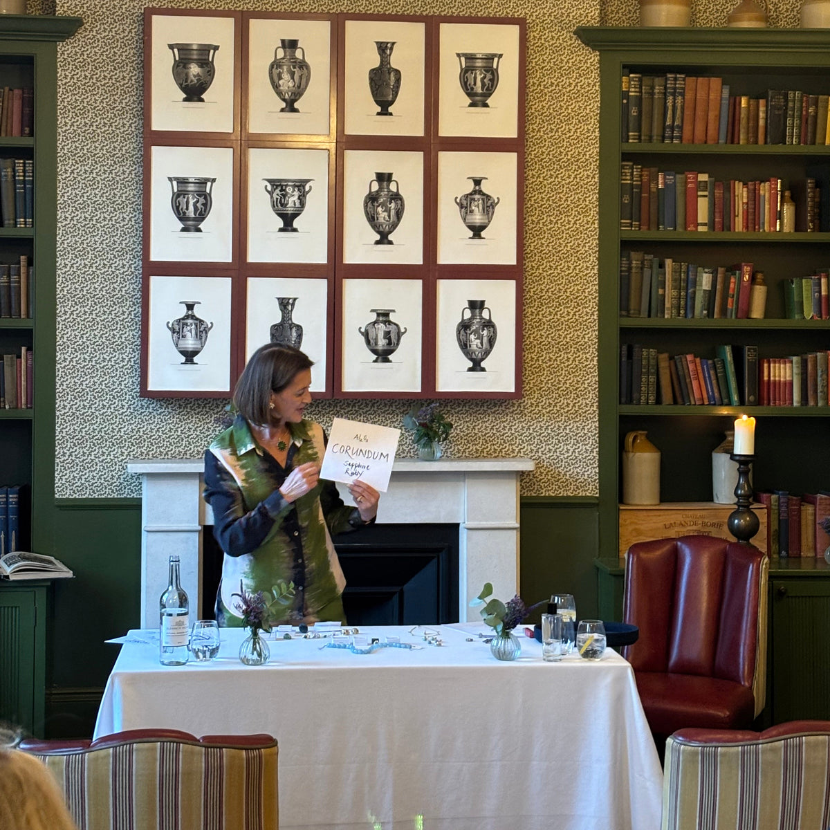 Cassandra Goad giving a talk at The Surprise pub in London of jewellery