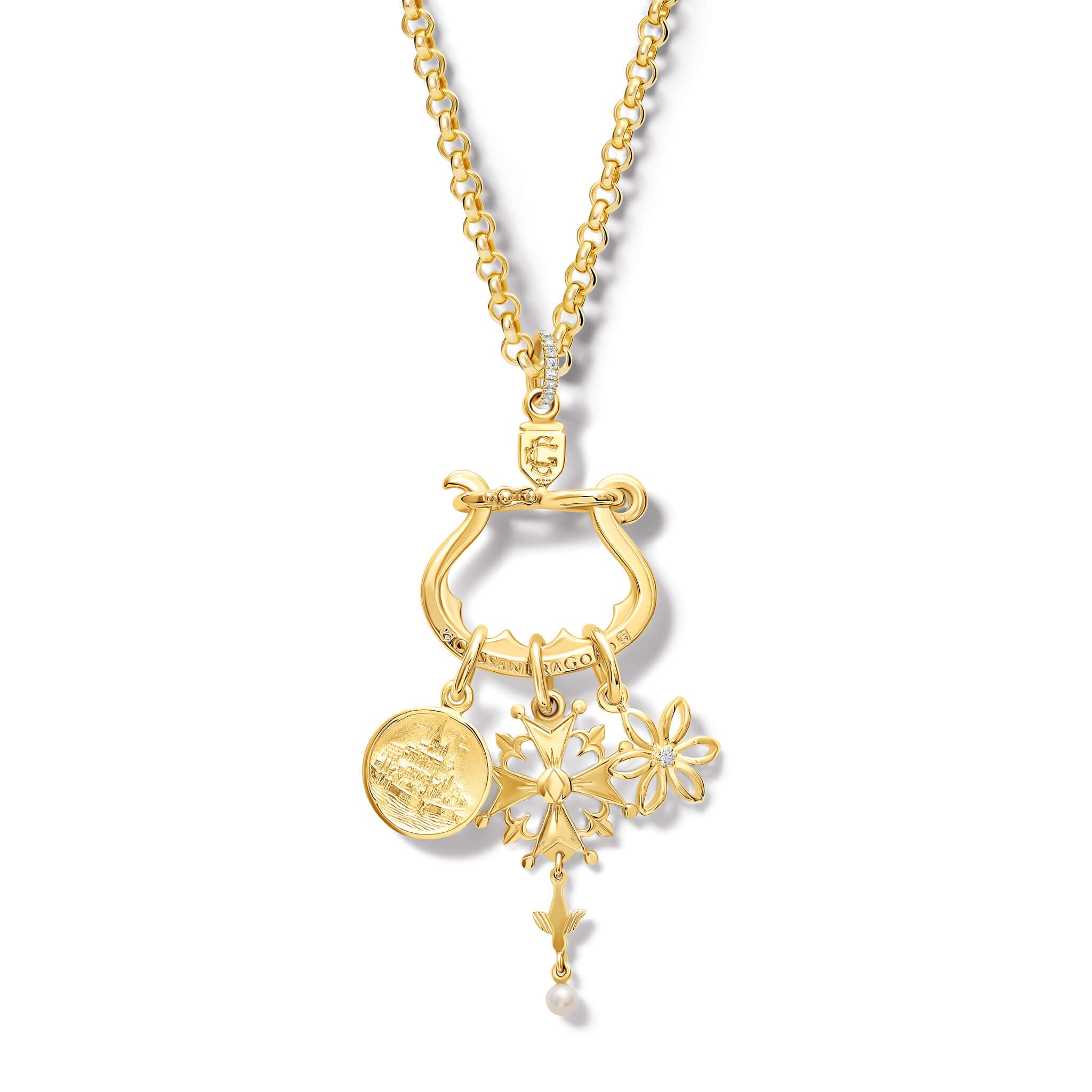 Model wearing a handcrafted yellow gold necklace pendant with three distinct charms elegantly suspended from it, set with diamond pave.