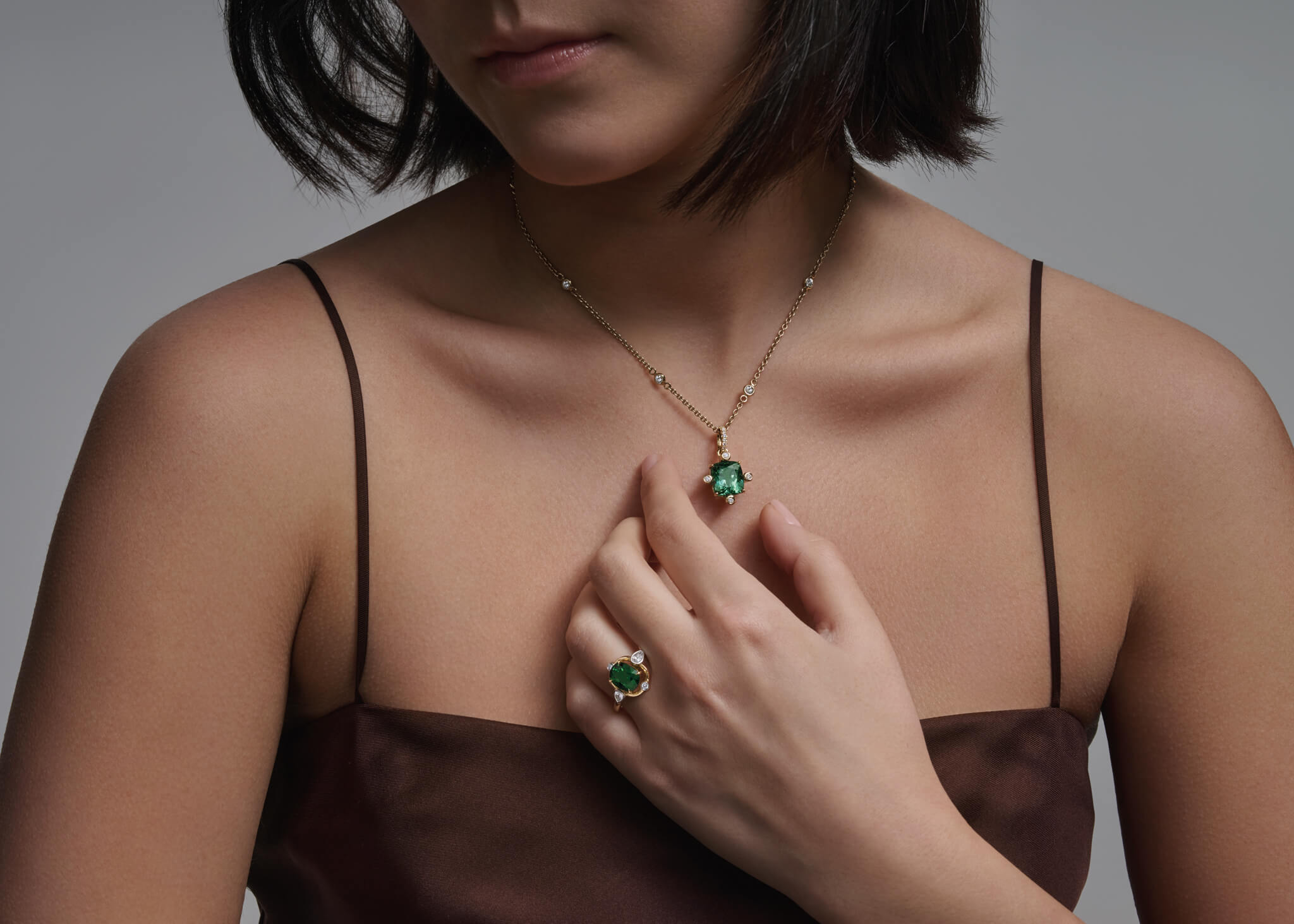 Model wears handcrafted fine jewellery from Cassandra's Compass design collection, inspired by the Greek affinity to the nautical. The Compass design is available in an array of gemstones.