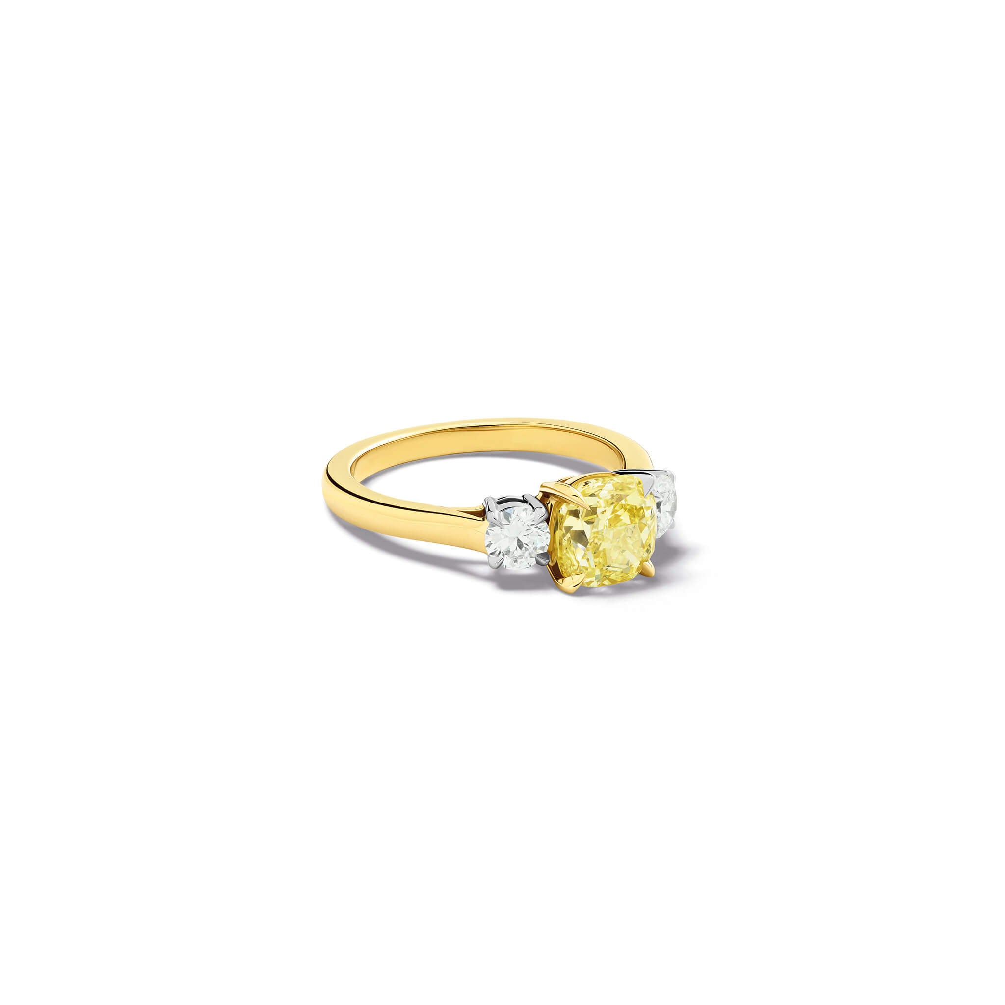 Handcrafted yellow gold yellow diamond engagement ring with two diamonds set in white gold on each side