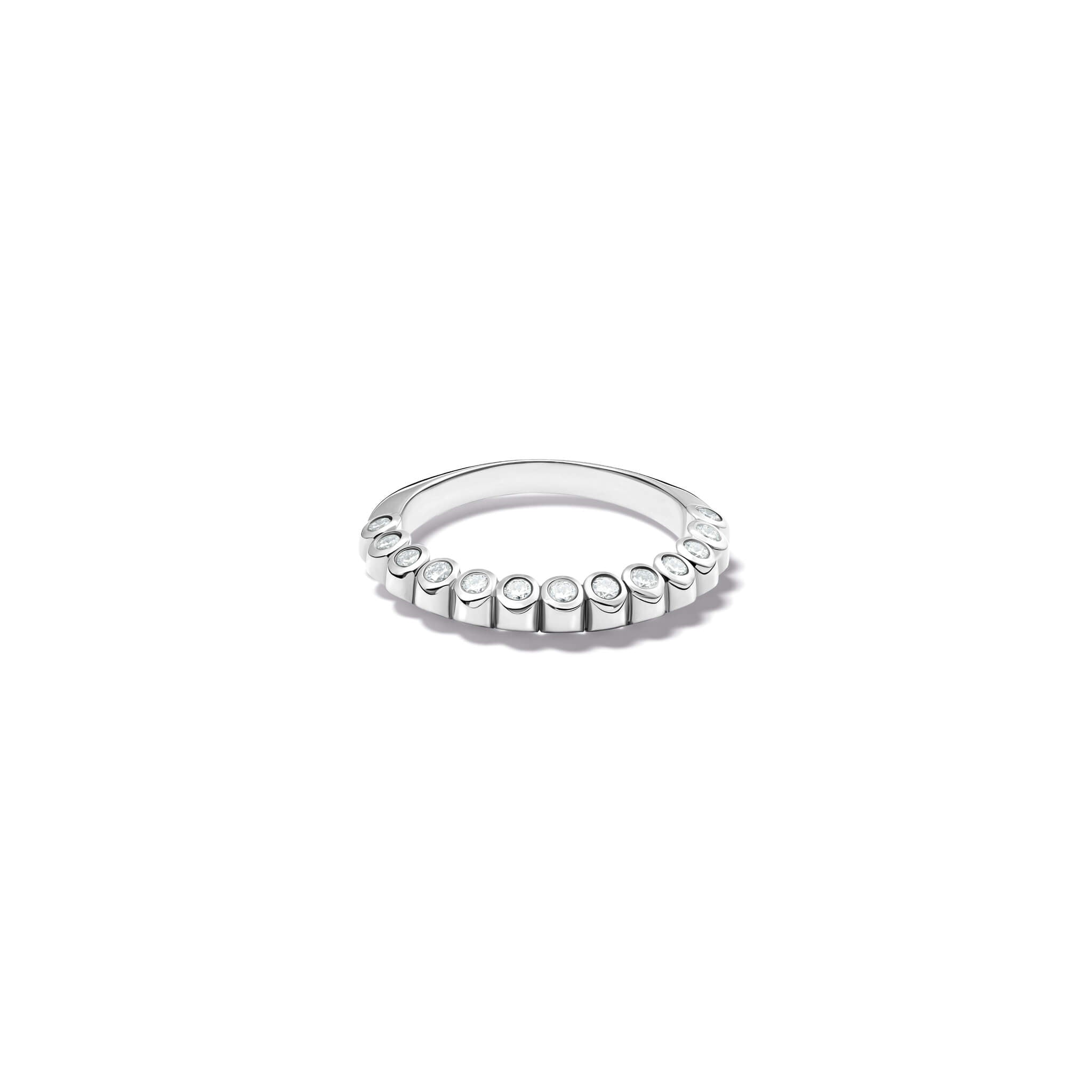 Handcrafted 18ct white gold eternity ring with diamonds on the side of the shank and smooth ridges along the top.