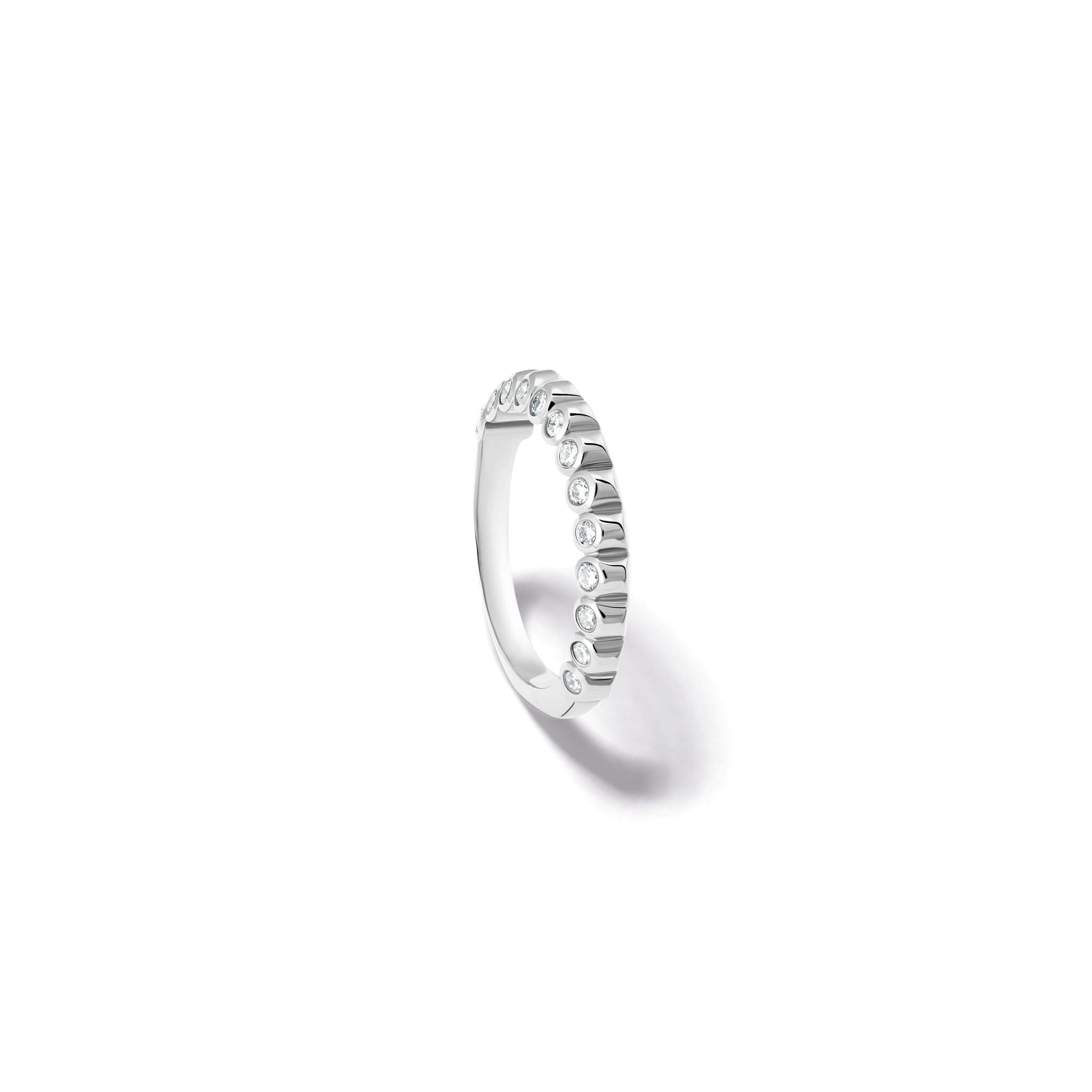 Handcrafted 18ct white gold eternity ring with diamonds on the side of the shank and smooth ridges along the top.