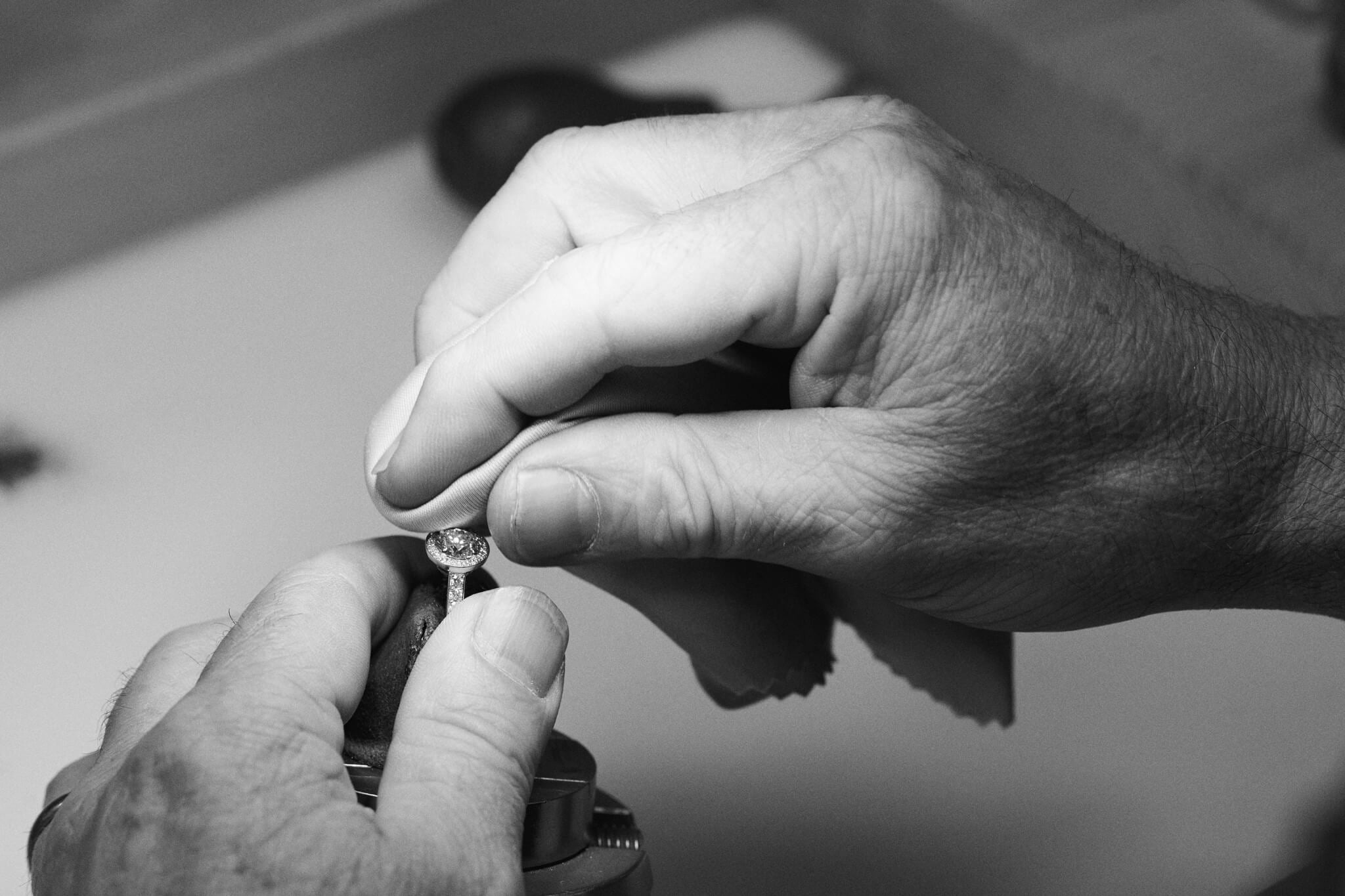 Craftsman polishes a handacrfted diamond ring in Cassandra Goad's London workshop.