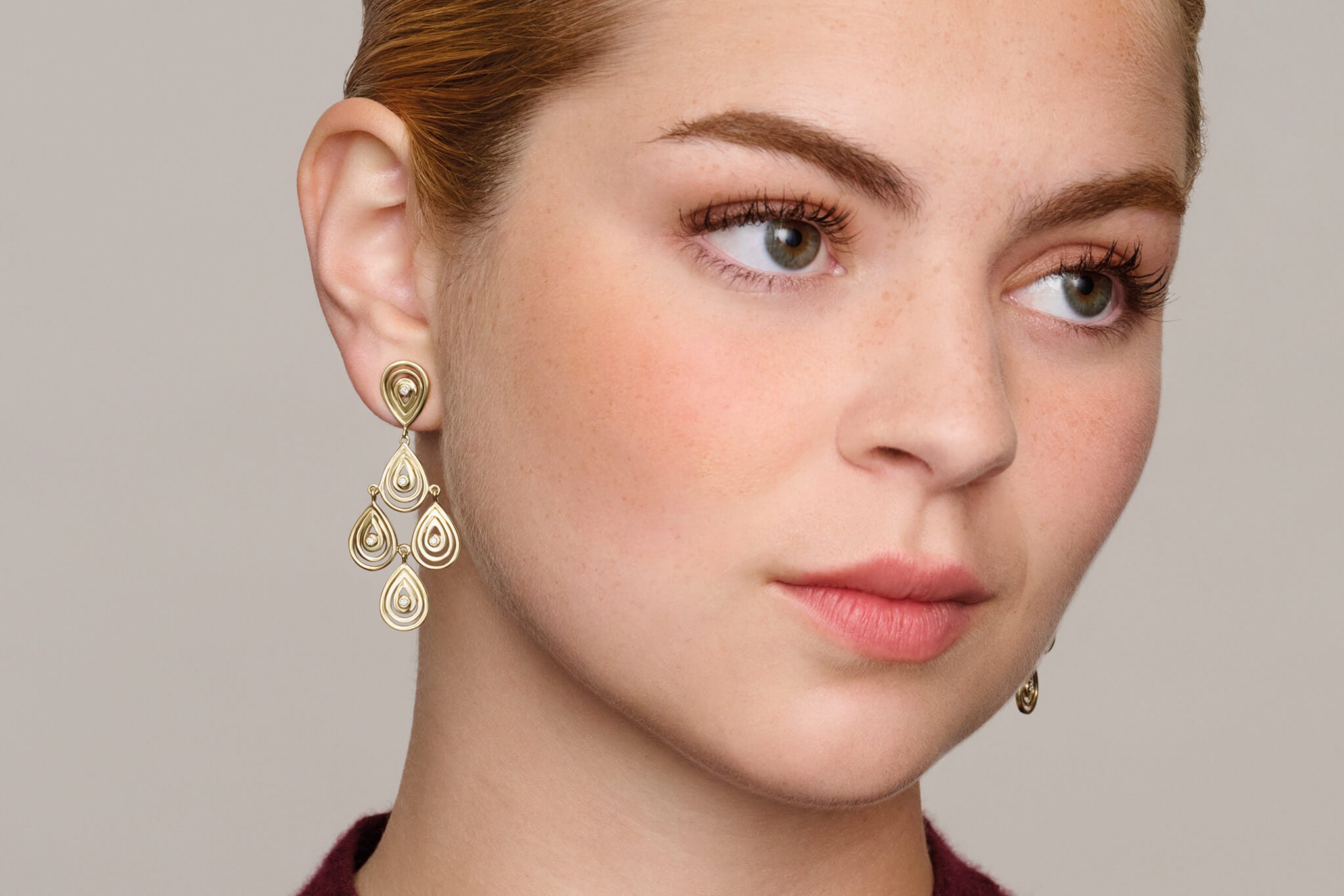 model wearing Capuri earrings