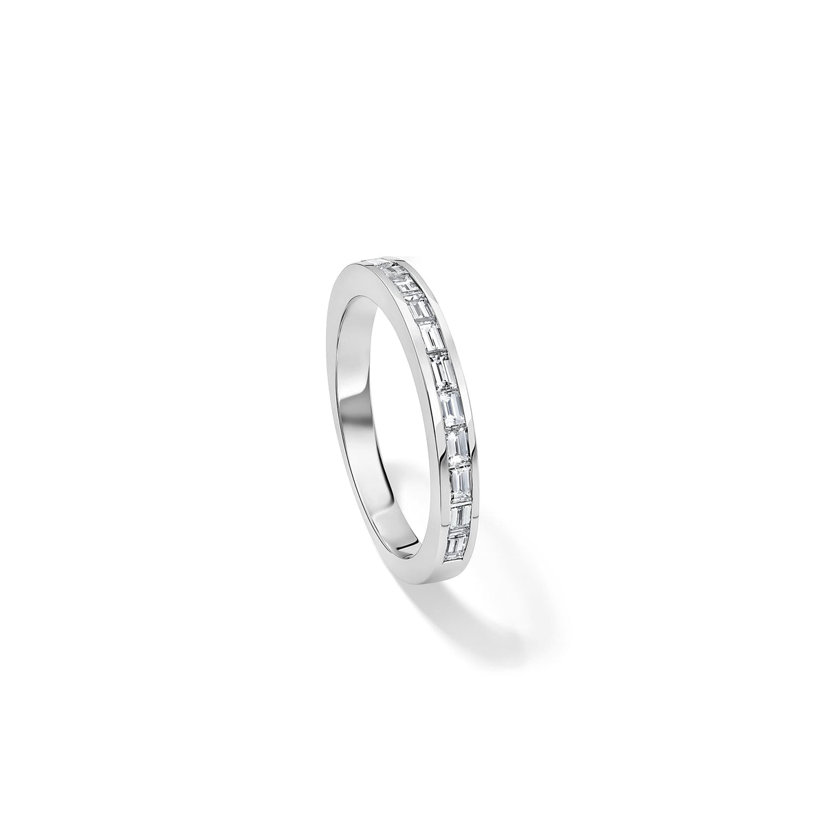 Handcrafted Elvira half-eternity ring in 18ct white gold with baguette cut diamond