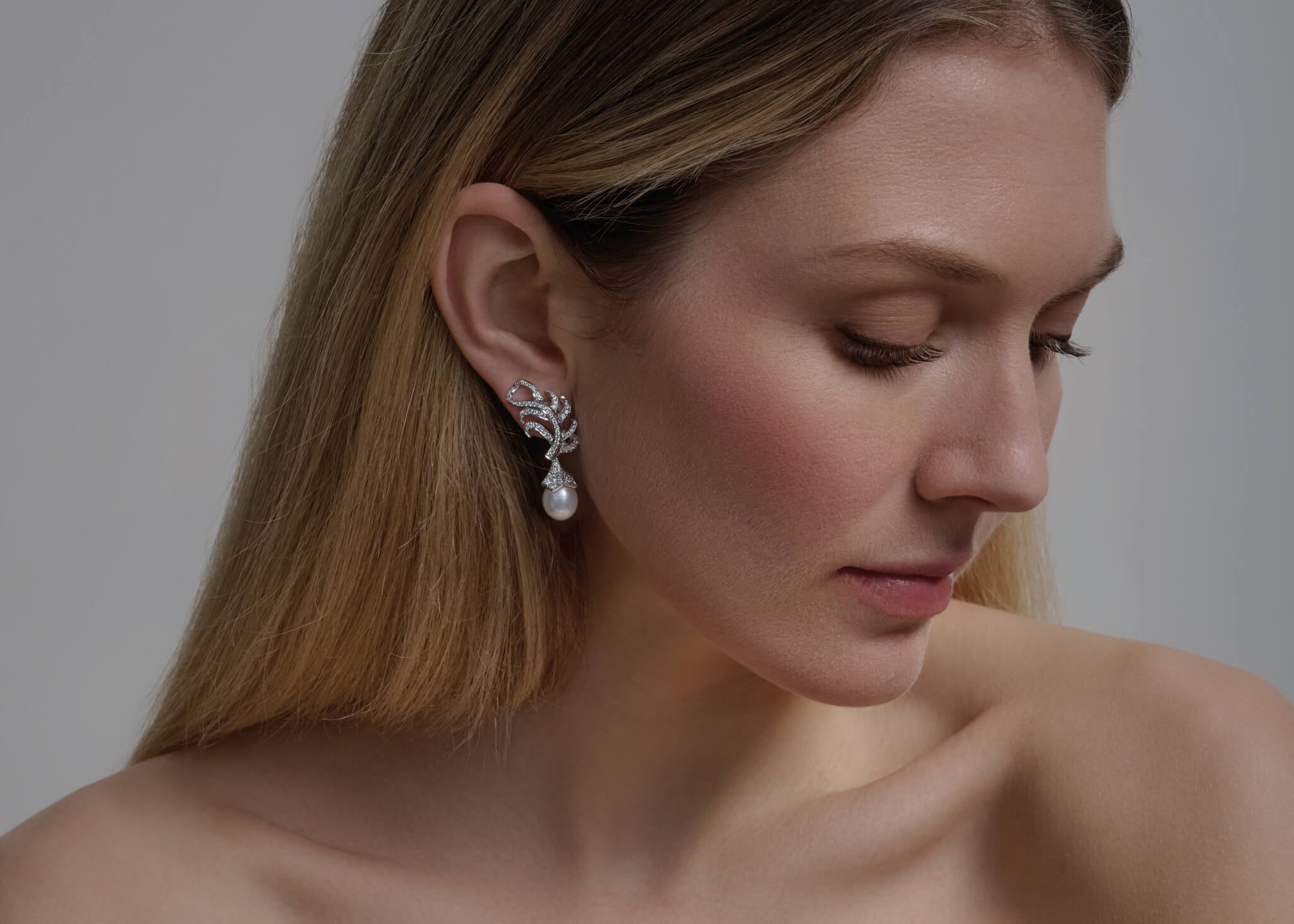 Model wears Feather Plume earrings.