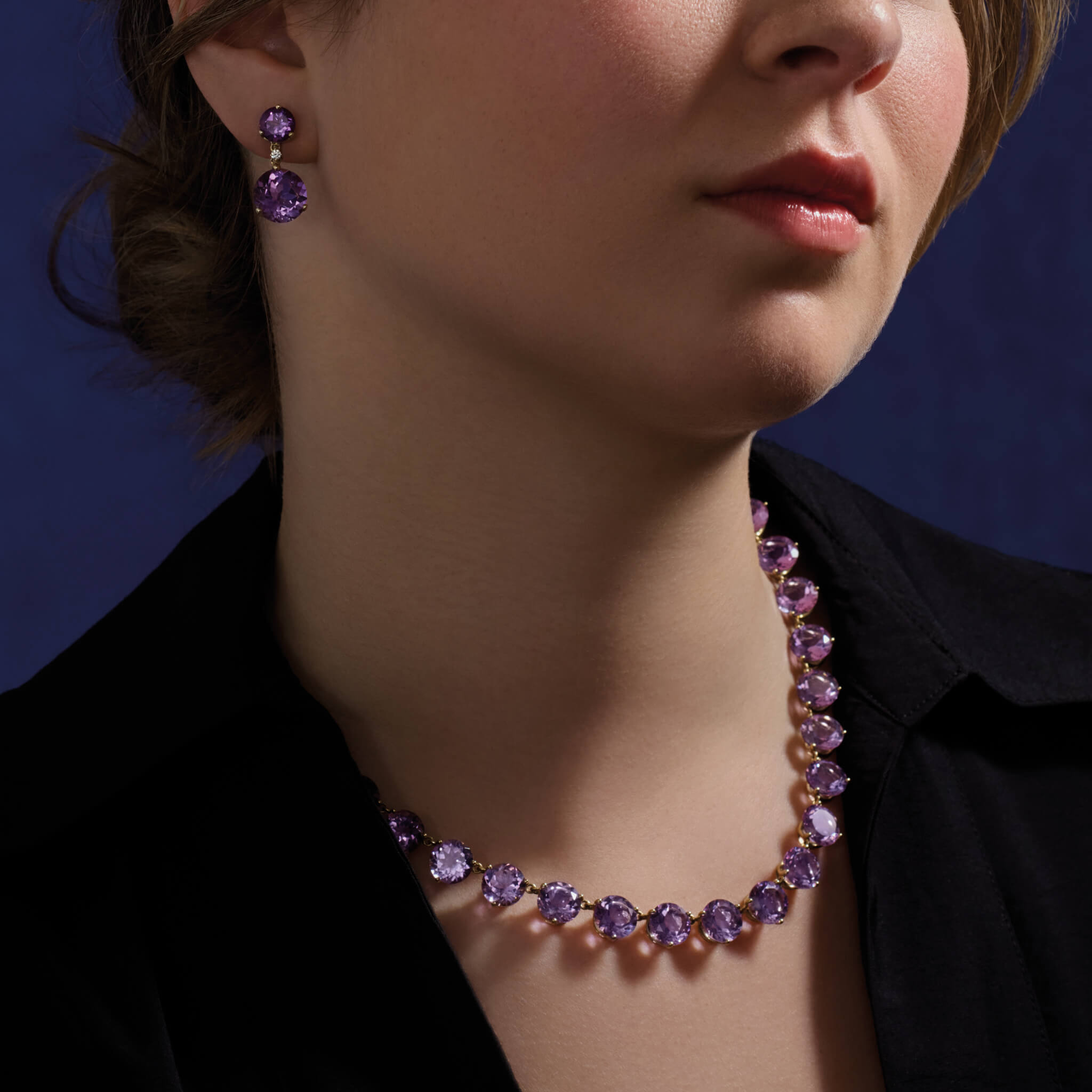 model wearing handcrafted amethyst jewels, February birthstone