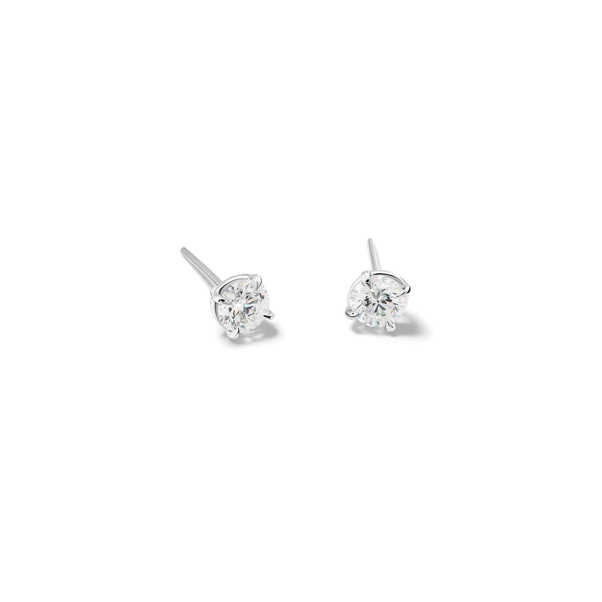 Handcrafted 18ct white gold stud earrings featuring round diamond, birthstone of april.